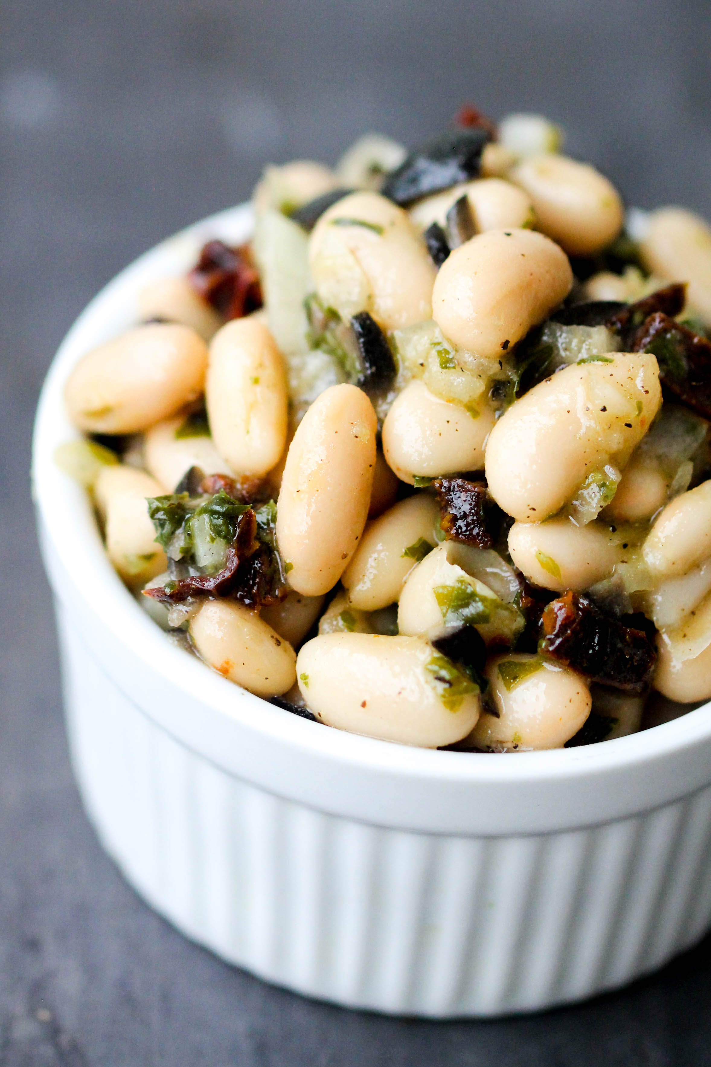 Cannellini Bean Salad with Basil and Sun-Dried Tomatoes makes a lovely light lunch or can be enjoyed as a refreshing side, or take it to a picnic, potluck. It is naturally vegan & gluten-free.