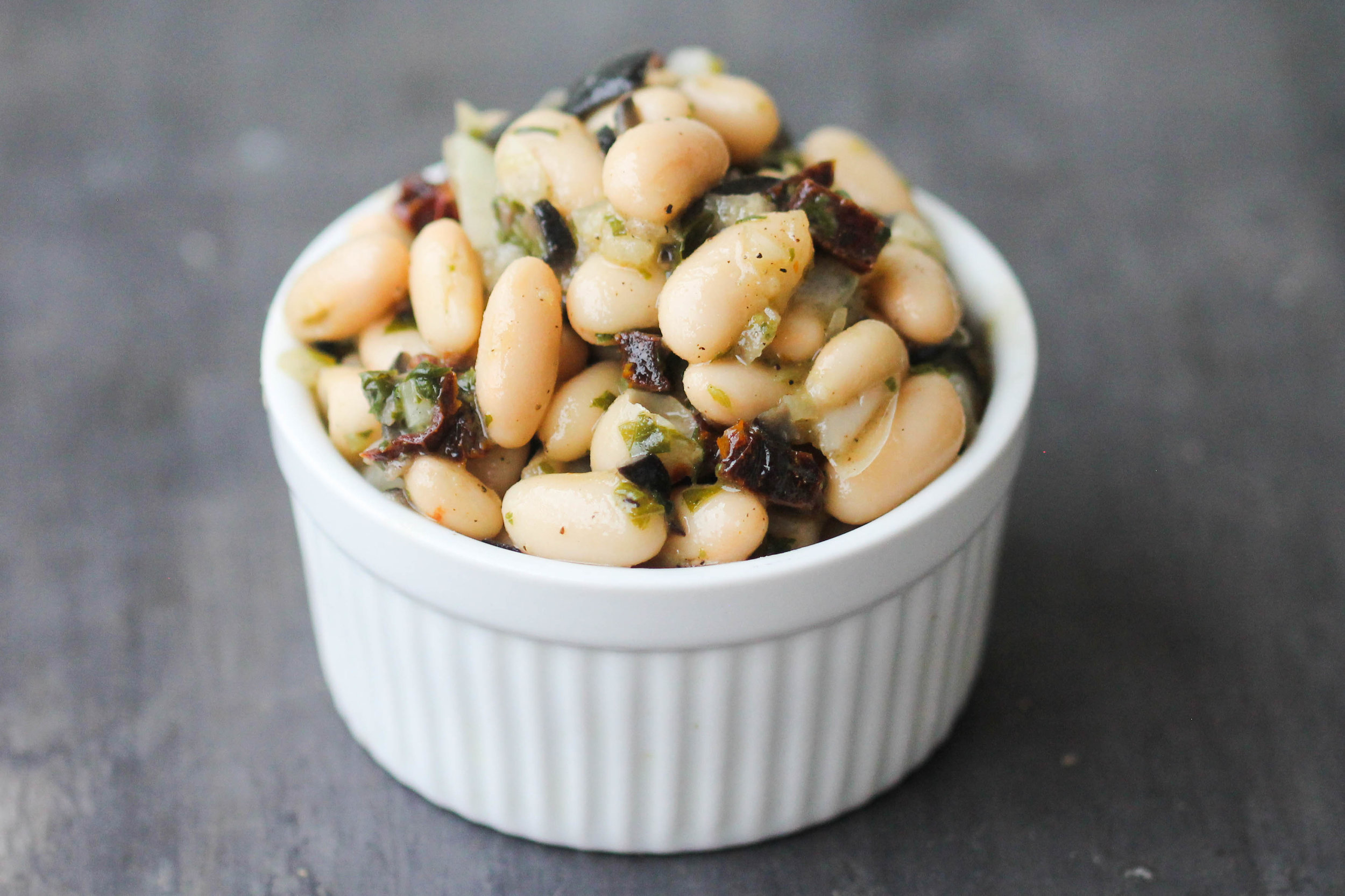 Cannellini Bean Salad with Basil and Sun-Dried Tomatoes makes a lovely light lunch or can be enjoyed as a refreshing side, or take it to a picnic, potluck. It is naturally vegan & gluten-free.