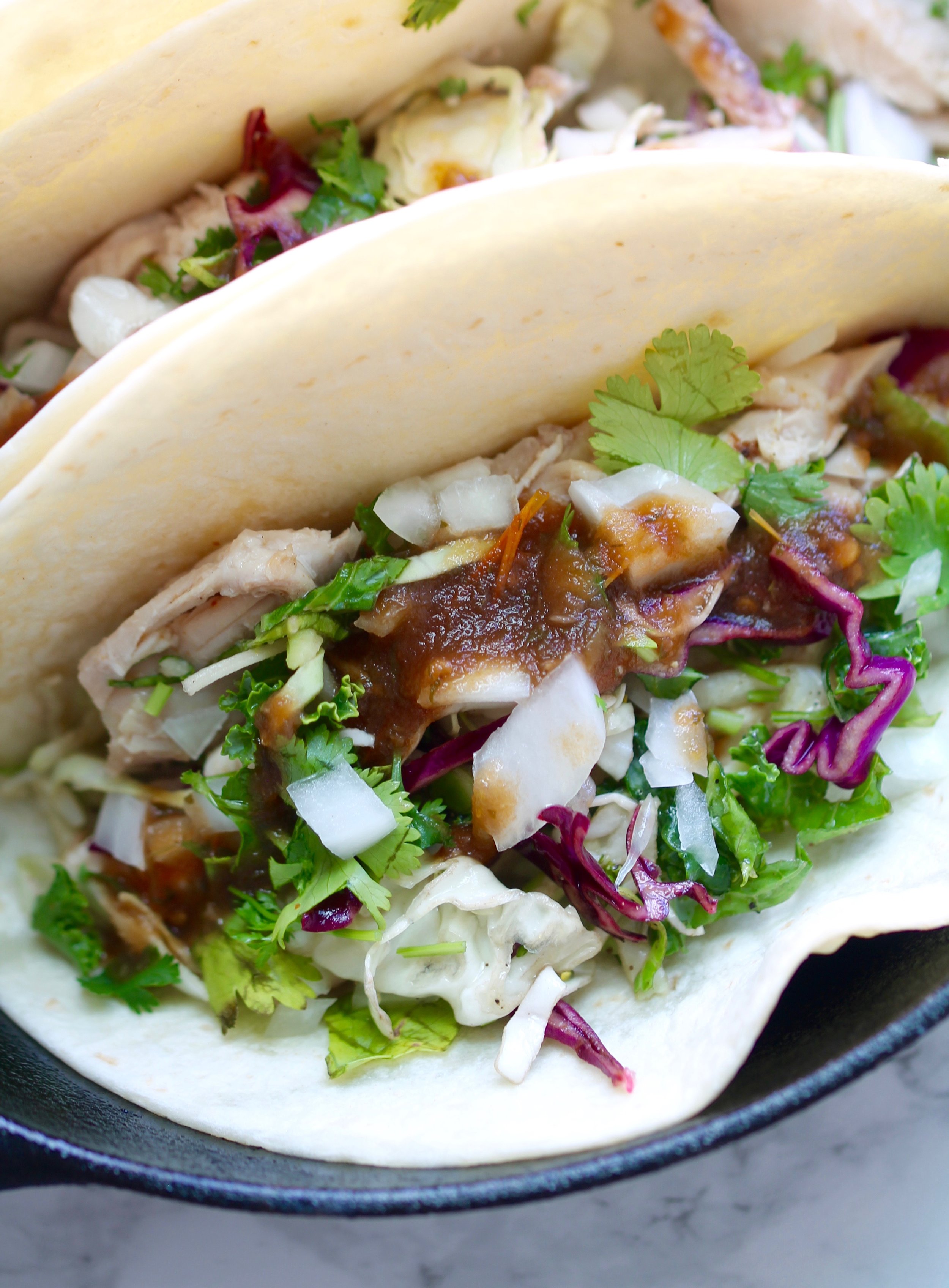 Roasted Chicken Tacos are dinner friendly for the whole family. Everything can be prepped ahead of time or bought directly from the store for convenience. 