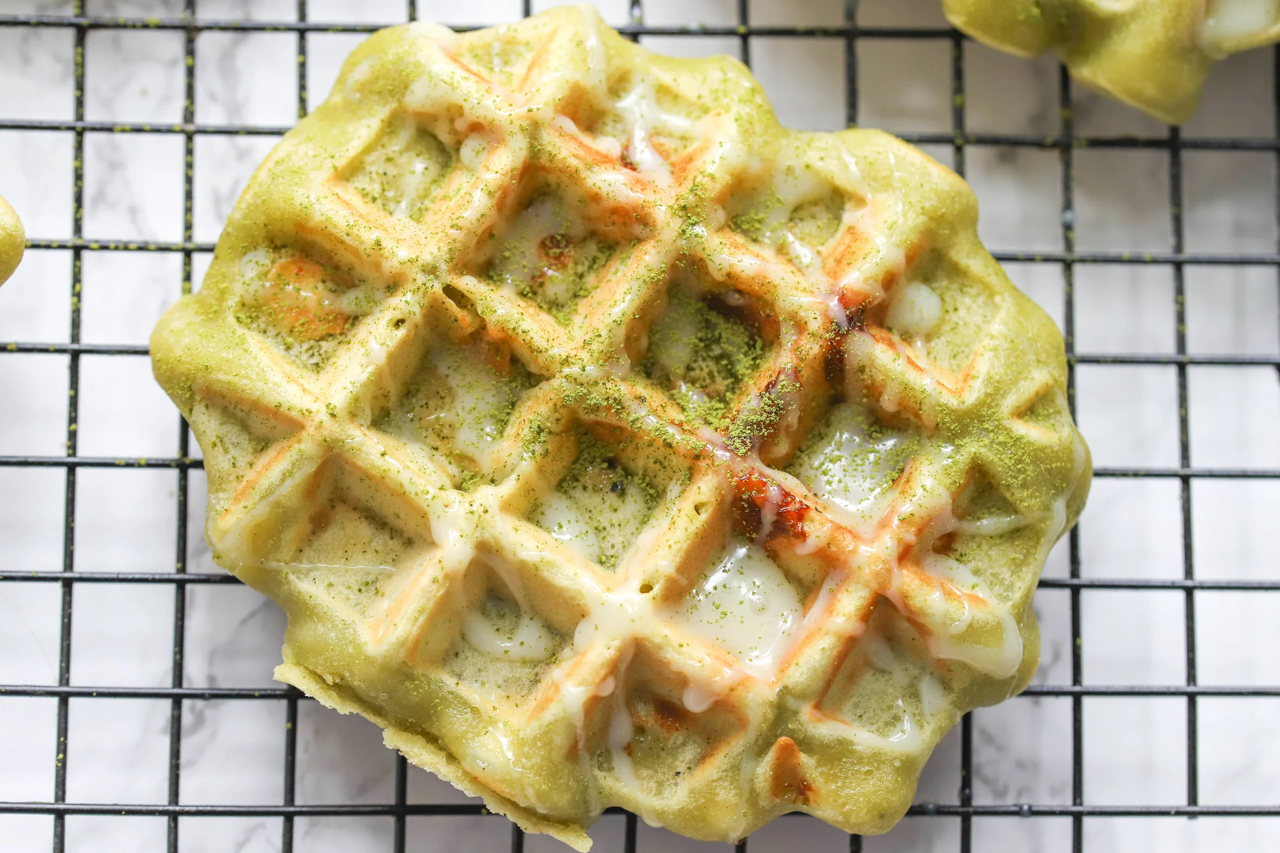 Matcha White Chocolate Waffles are almost vegan and totally decadent to make your morning special! There is a hint of matcha flavor in every bite and pairs beautifully with white chocolate chips!
