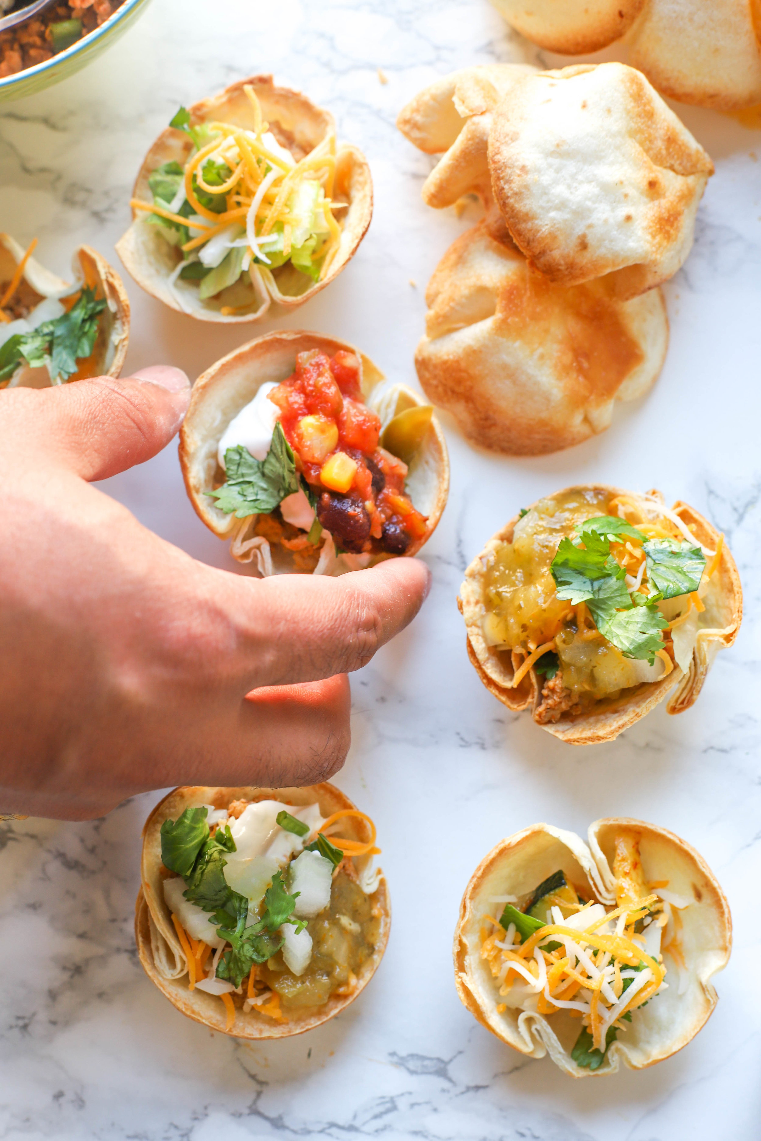 DIY Taco Cups are easy & fun spin on traditional tacos with endless options for everyone including vegetarians, vegans, and gluten-free individuals! 