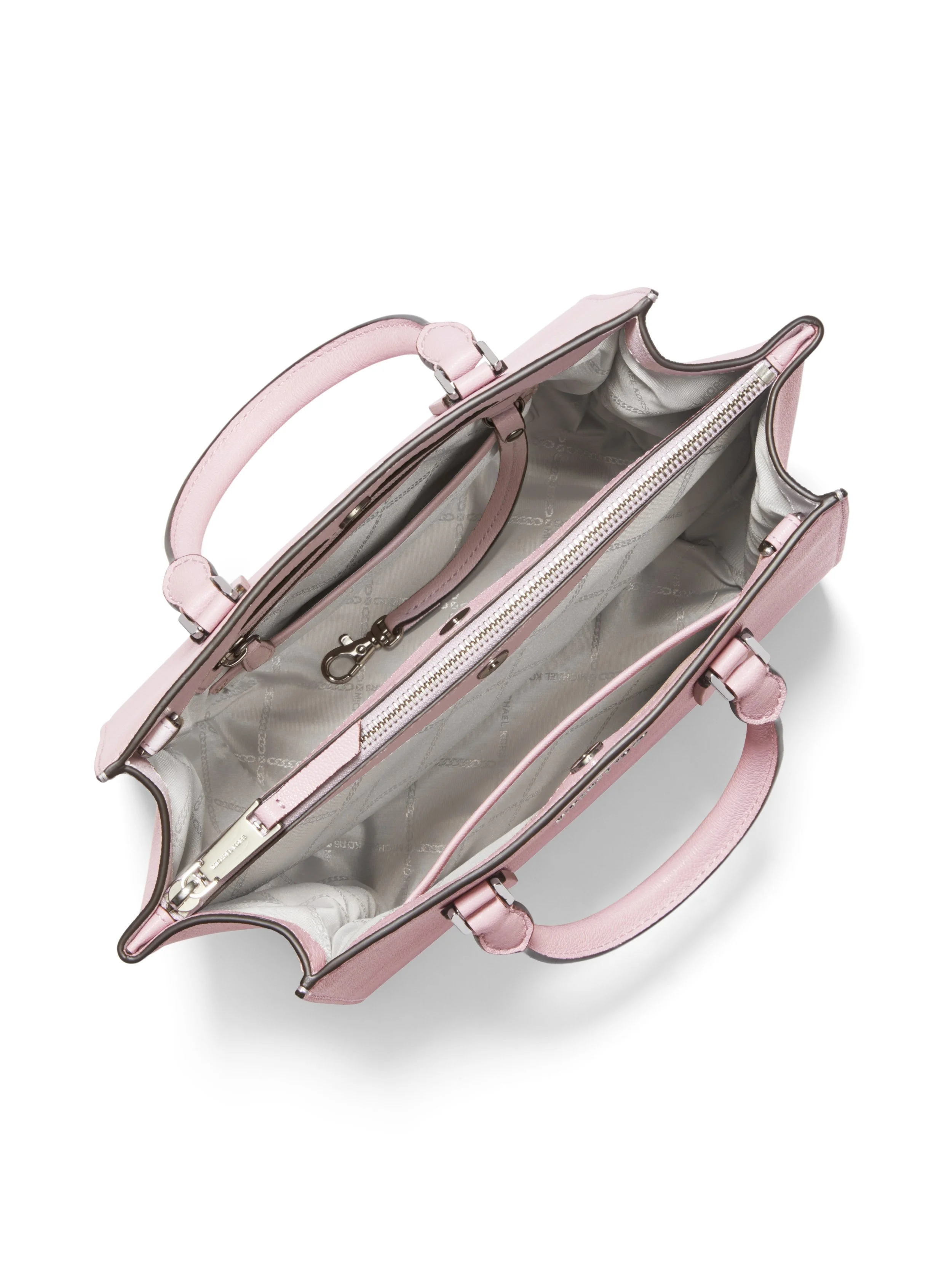 Top view of an open pink handbag with a gray interior, multiple compartments, zipper, and metallic accents