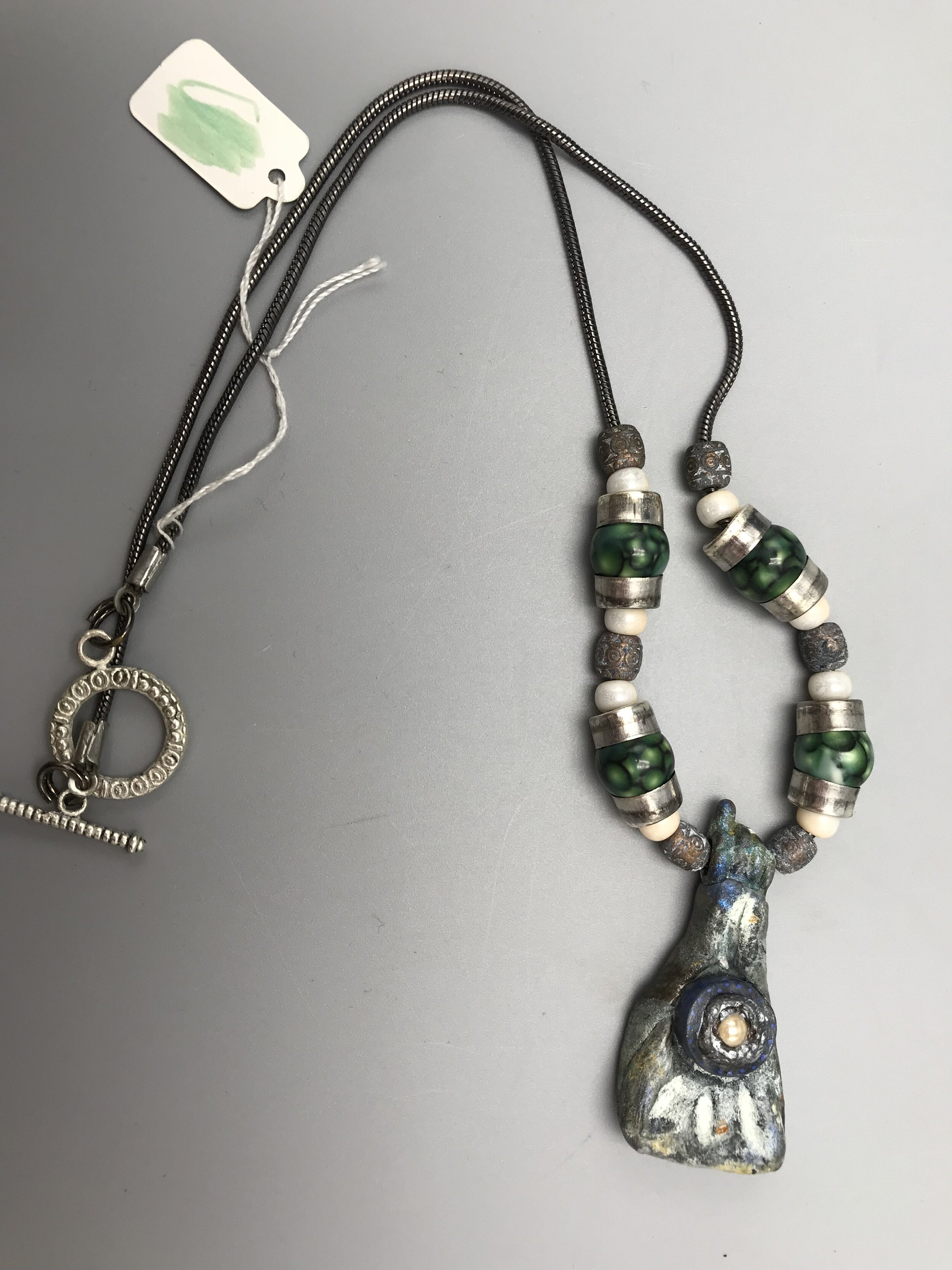 Blue Green Resin pendant necklace with fist  SOLD