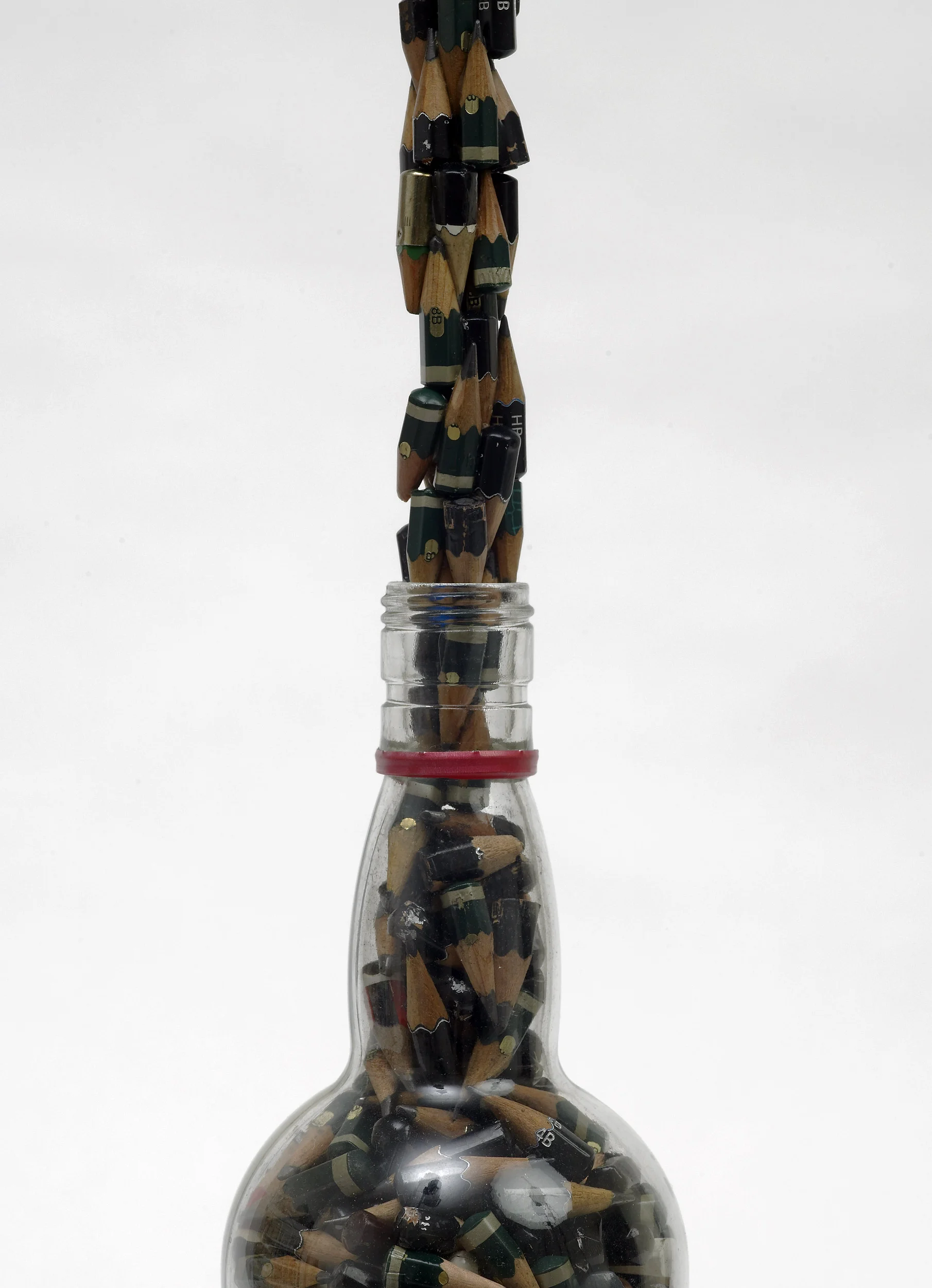 Bottle and Used Pencils