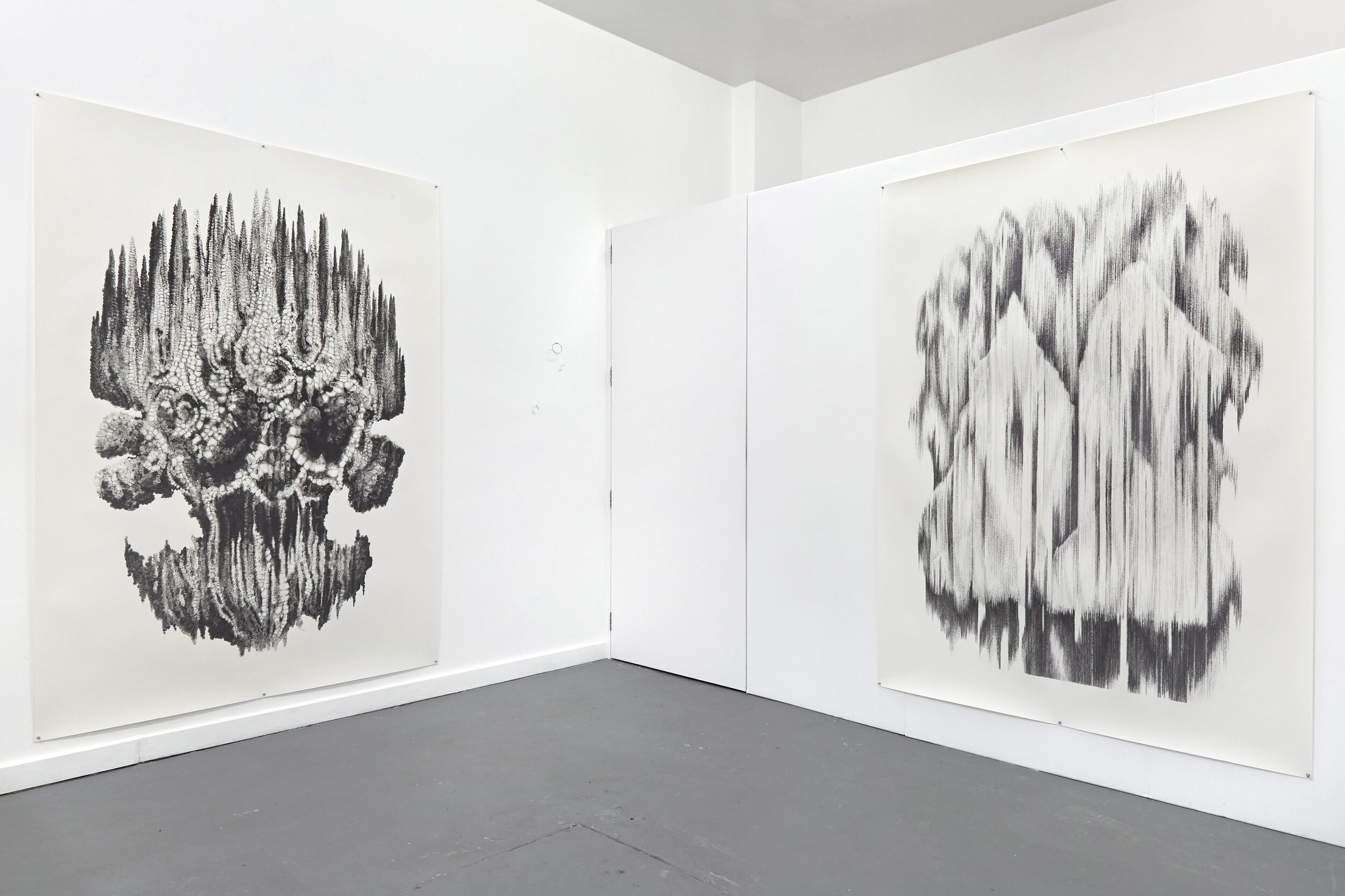  Installation view of ‘Floating Heads’ exhibition at Xxijra Hii project space in Deptford, London, 2021. On the left: ‘Oiwa’, pencil on paper, 231.5 x 171cm, in the centre (just visible) ‘Motes’, wire and clay, dimensions variable but all tiny, on th