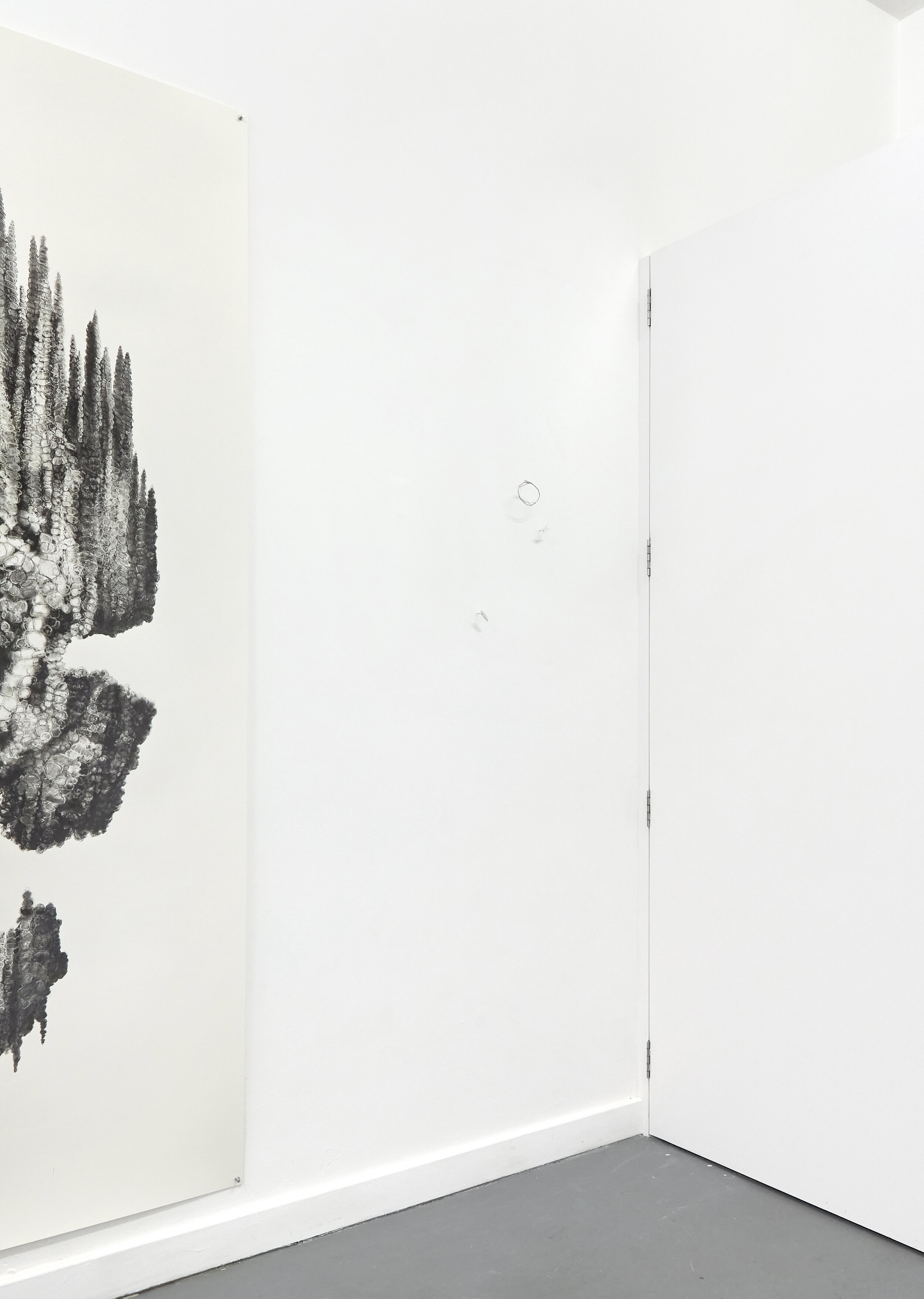 Installation view of ‘Floating Heads’ exhibition at Xxijra Hii project space in Deptford, London, 2021. On the left: ‘Oiwa’, pencil on paper, 231.5 x 171cm, 2021. On the right (just visible) 3 ‘Motes’, wire and clay, dimensions variable but all tiny