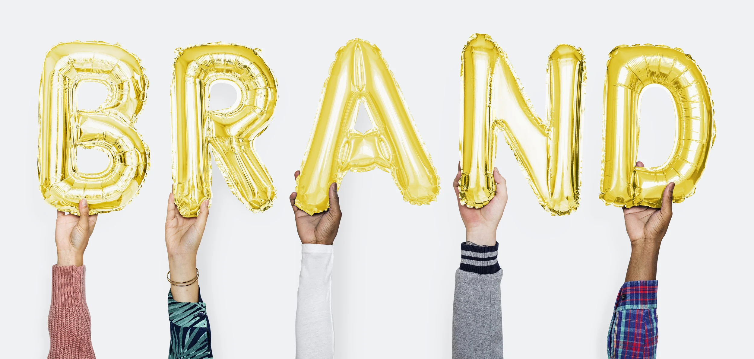 Hands showing brand balloons word