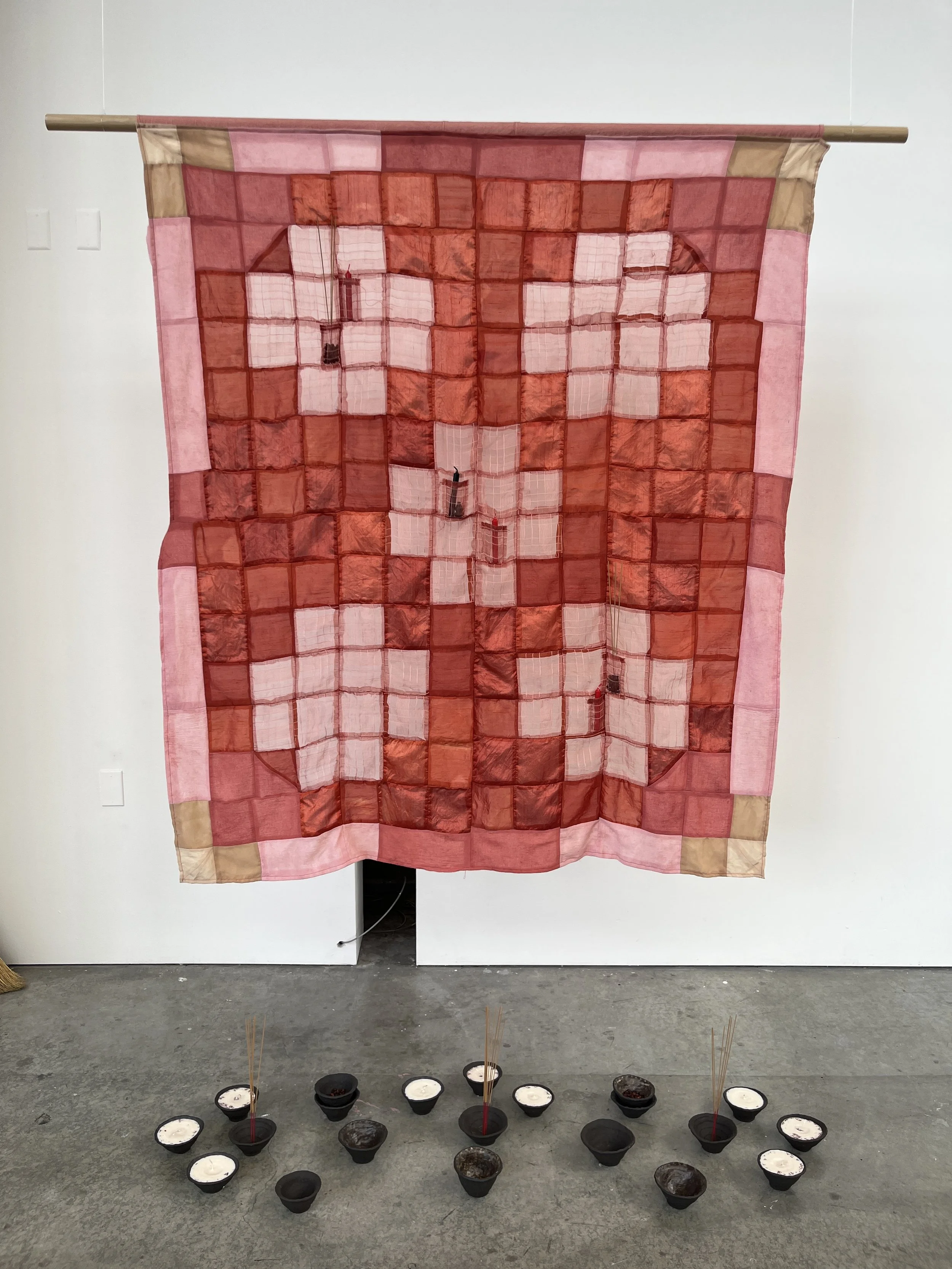   clearing (an altar for scared rage) , 2025  silk and cotton dyed with madder root and hawthorn, ceramic, soy wax, incense    Hallowed  , 2025, CCA PLAySPACE Gallery, SF, CA 