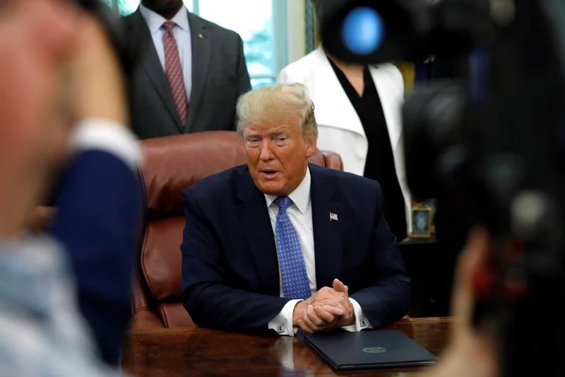immig trump suit.jpg