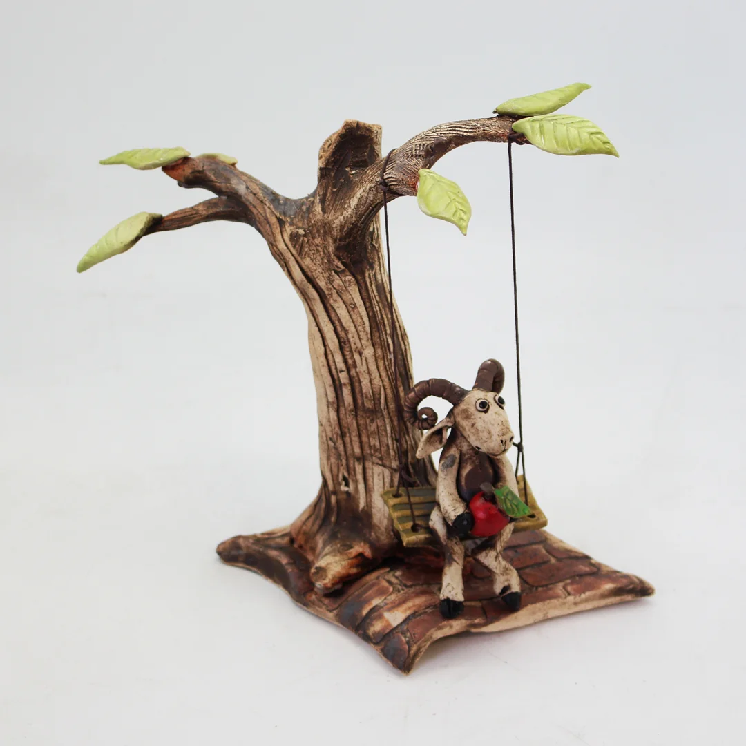 Goat on a Swing