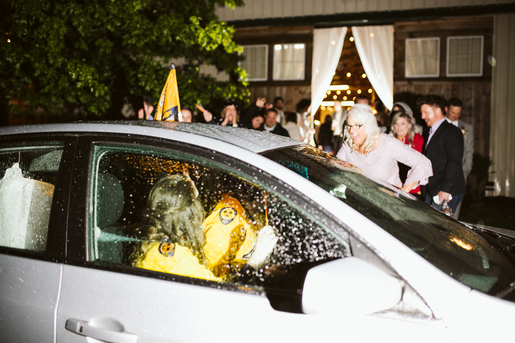 A Nashville predators themed Glow stick exit after a rustic wedding at Barn in the Bend in Nashville, Tennessee
