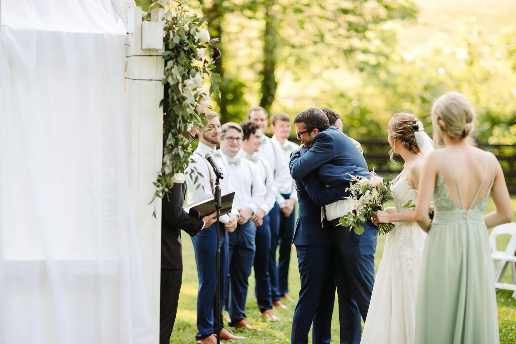 Father hands off his daughter to her groom at a stables at strawberry creek wedding in knoxville, tennessee