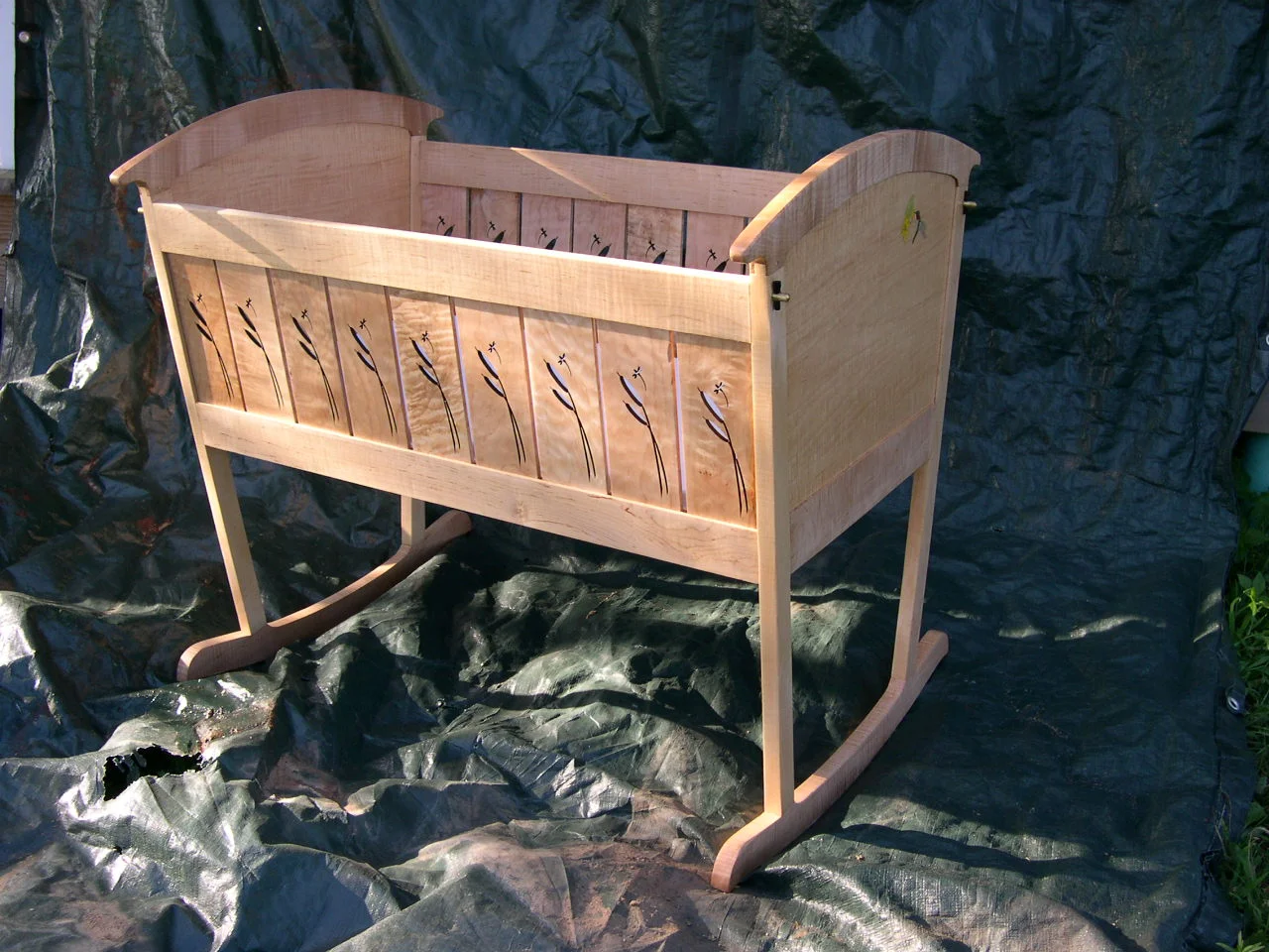 Figured maple cradle with pussywillows and dragonflies