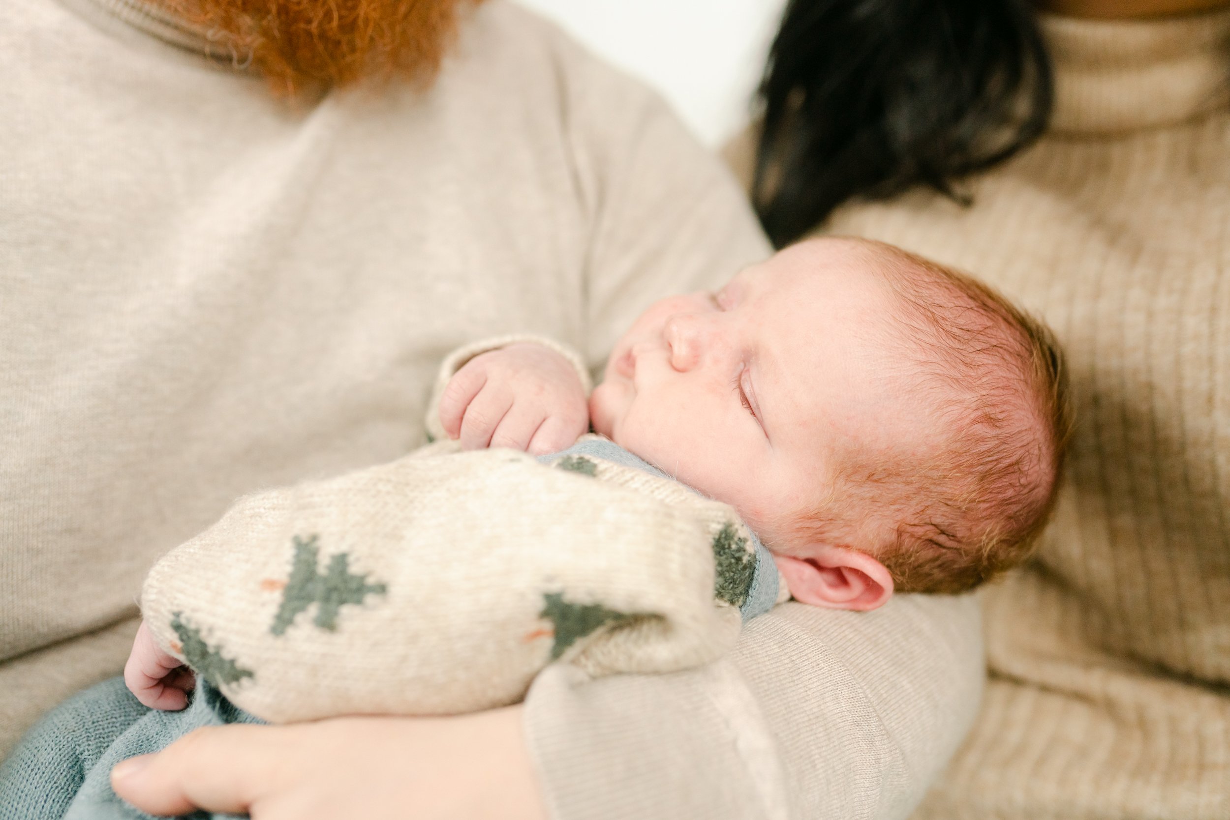 newborn in father's arms 