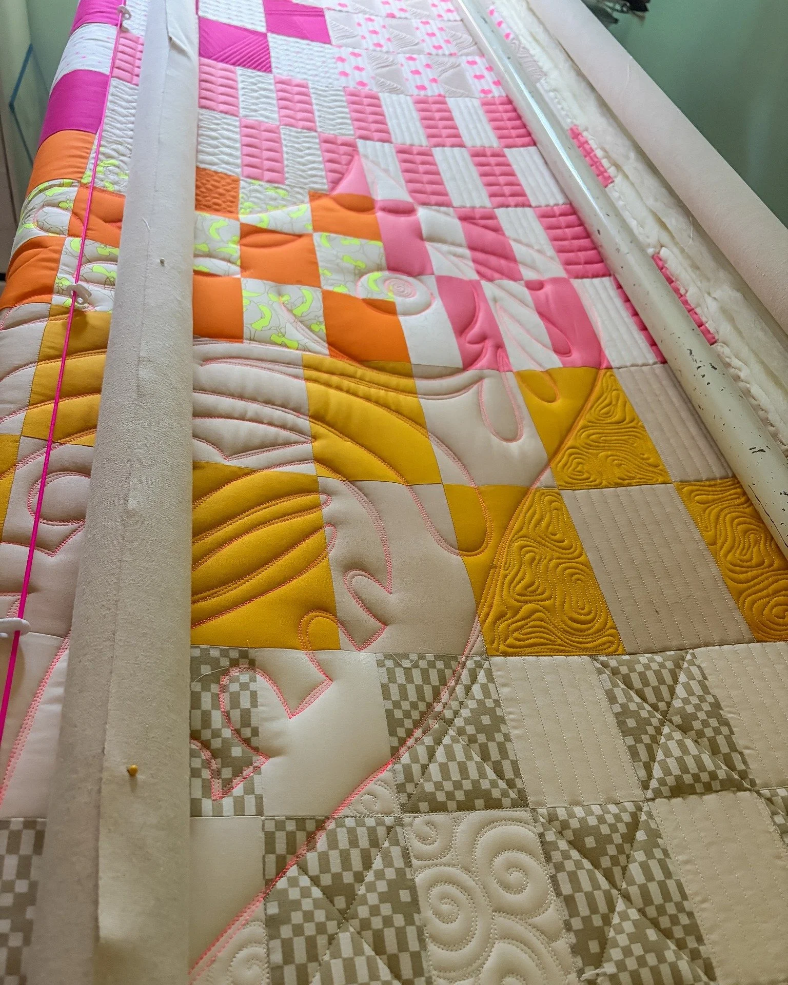 When I quilt I often focus on the details of the section I'm working on. Is my thread colour right, is the motif I picked working for this spot. And I get so caught up in that that I forget the big pictures. 

I finished the pass on this quilt, and l