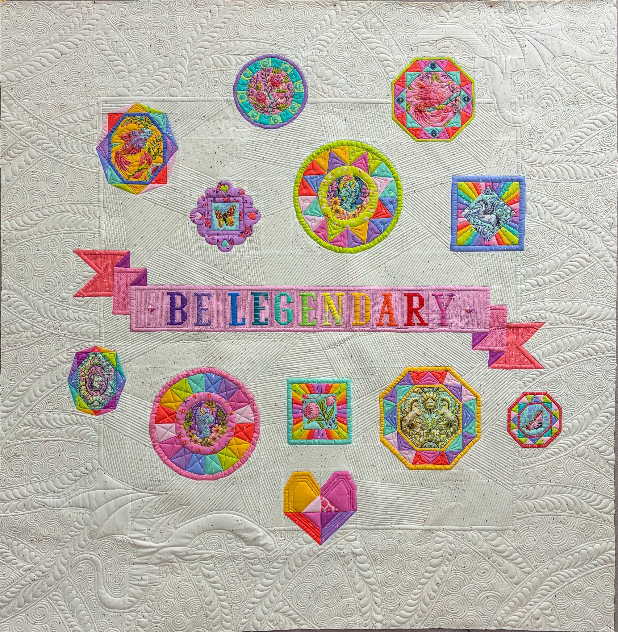 I finally get to share the Be Legendary quilt I quilted for @happysewlucky this summer!  I was so happy with how it turned out! 

Let's quickly talk process here: those dragons right? I cannot draw a dragon in a way I am happy with, so I took the ima
