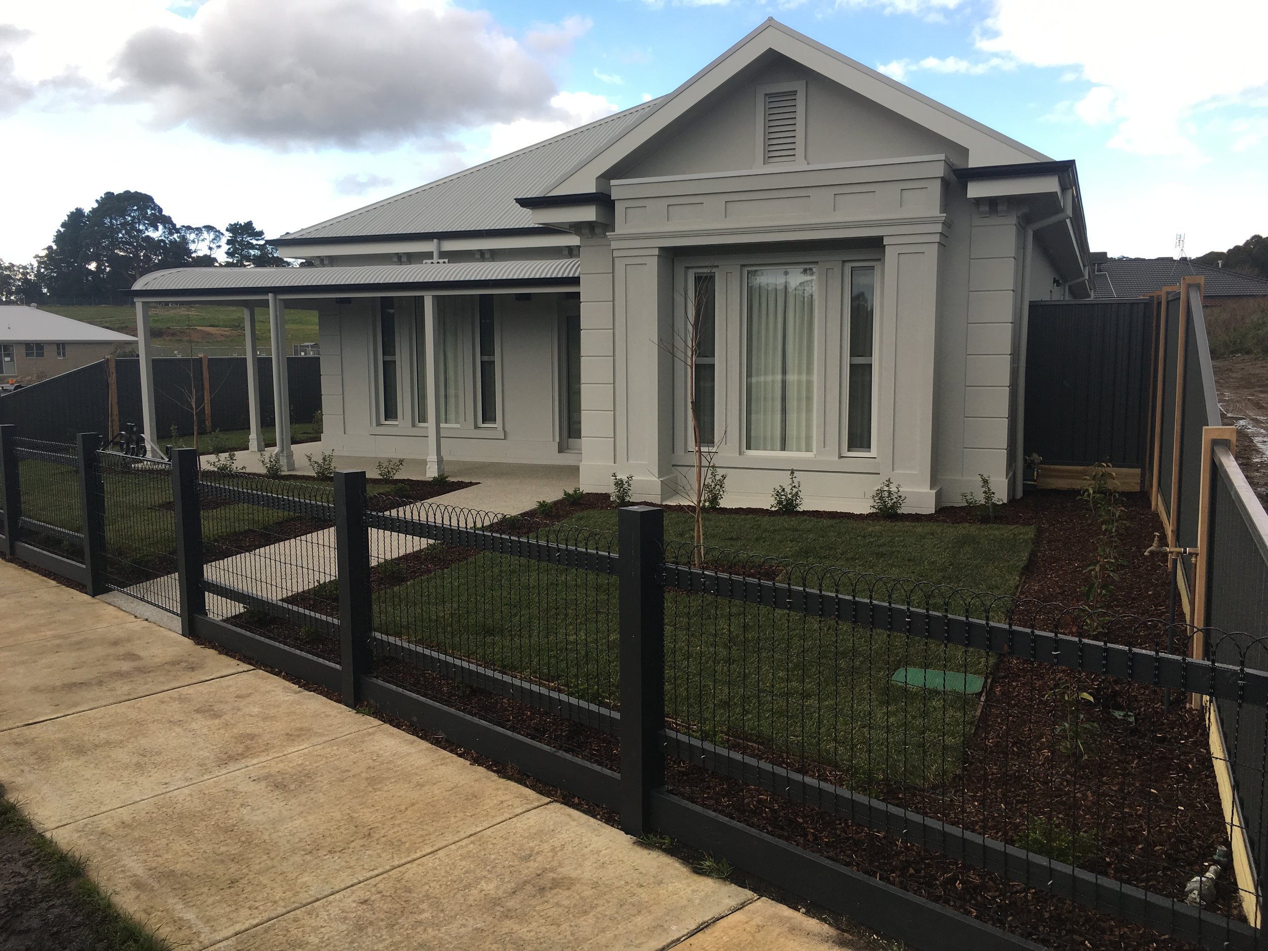 Garden beds and instant turf with large format paver path