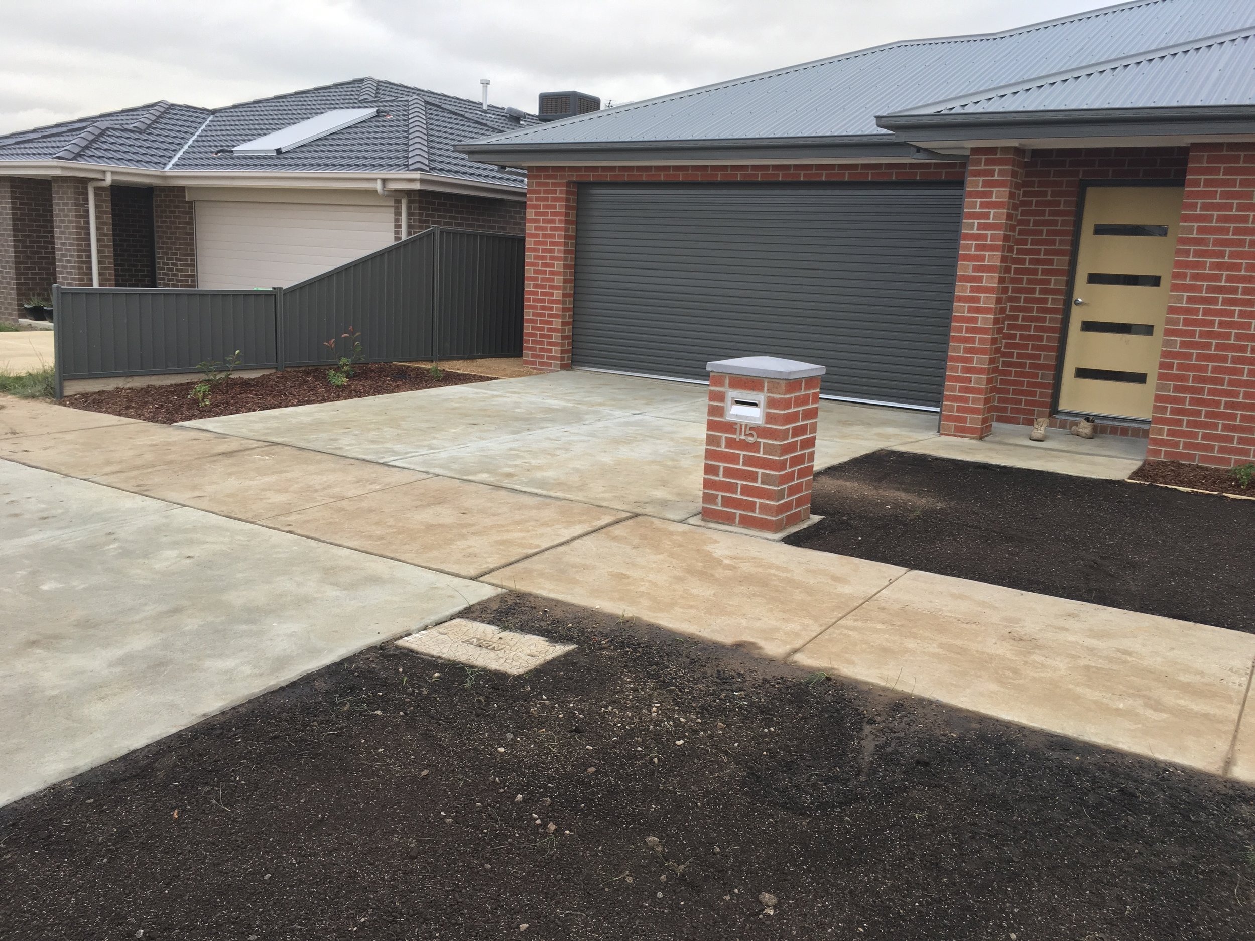 Progress shot installing garden bed and instant turf