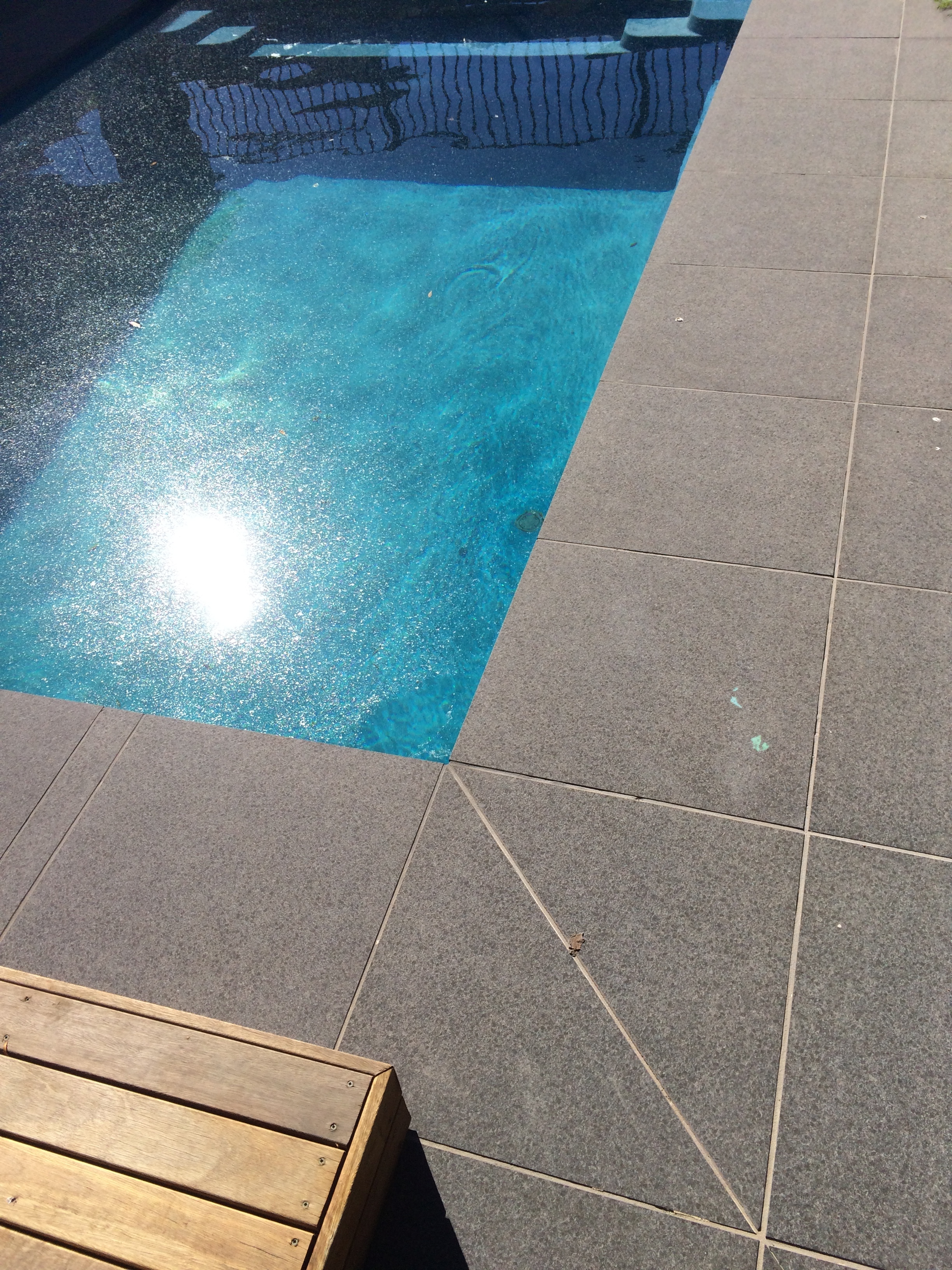 Paving around pool in stack bond style