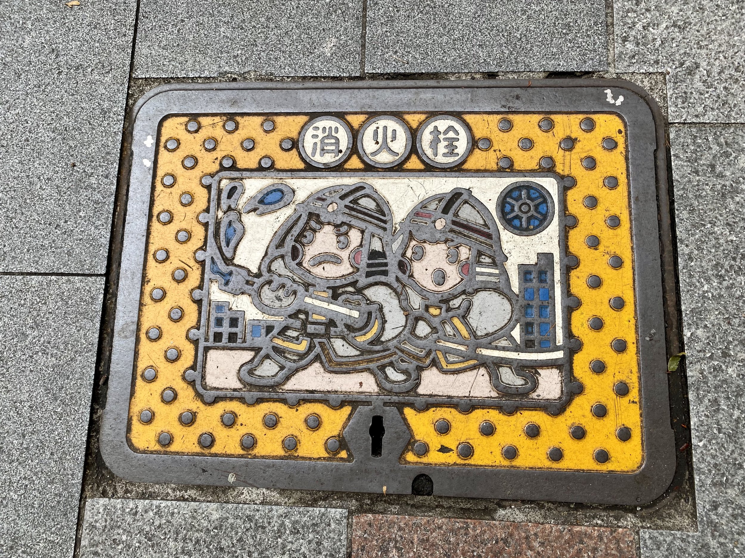 Manhole cover with action image
