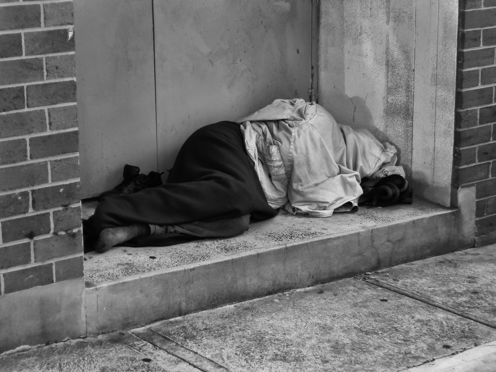 Homeless-Man-Sleeping-in-Doorway.jpg