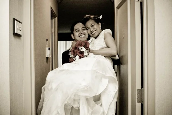 Carrying the bride over threshold.jpg