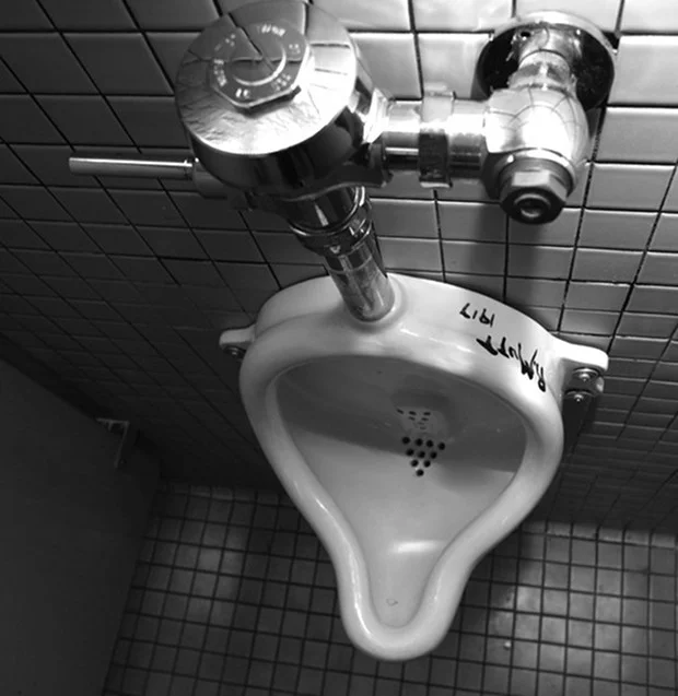 Tania Bruguera putting Duchamp's Fountain back into use at Queens Museum of Art, NYC