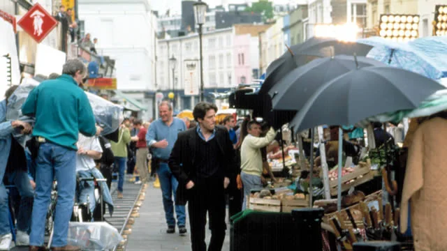 Hugh Grant on the set of Notting Hill (1999).