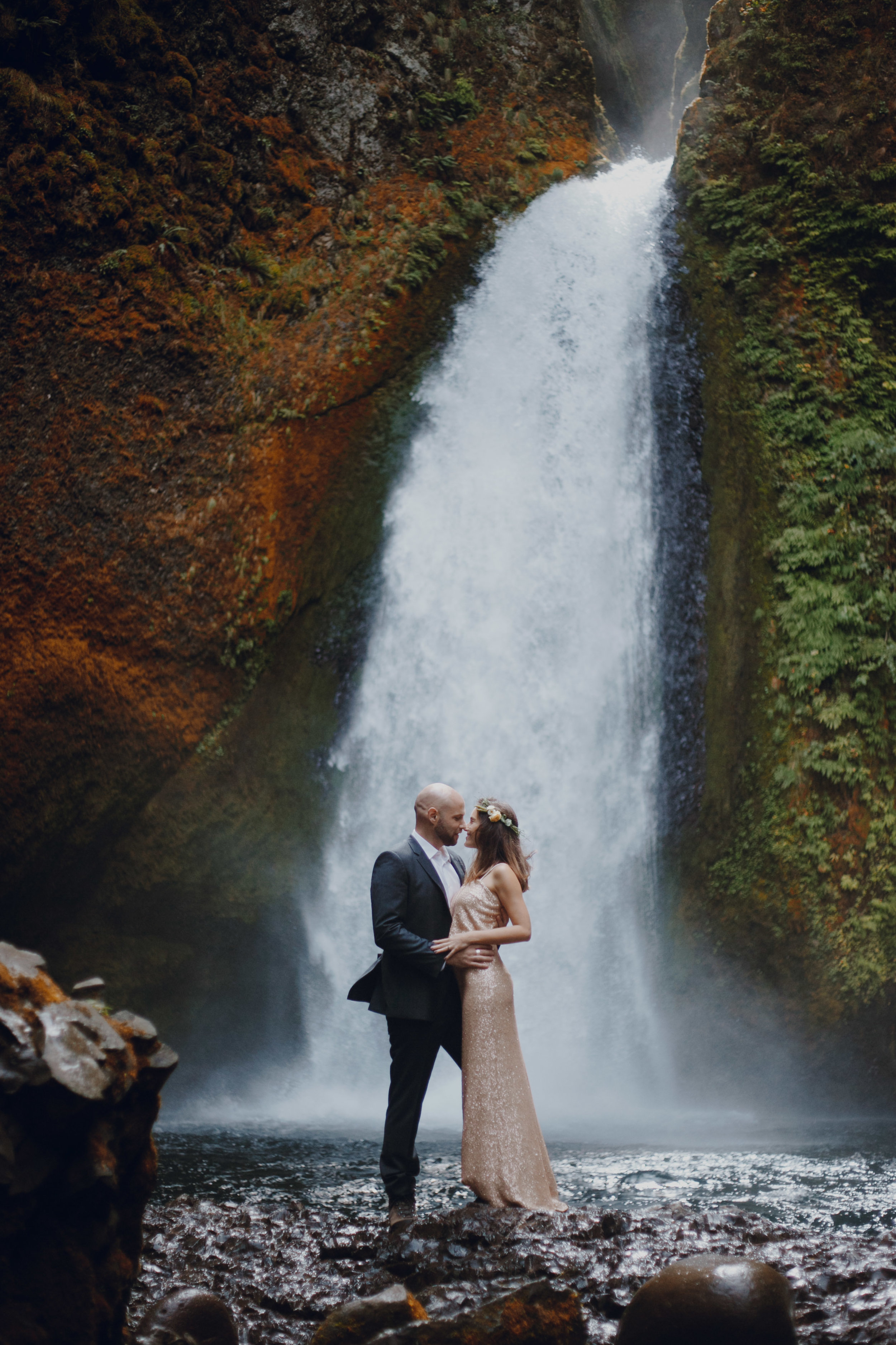  Couple getting married in front of the falls. 