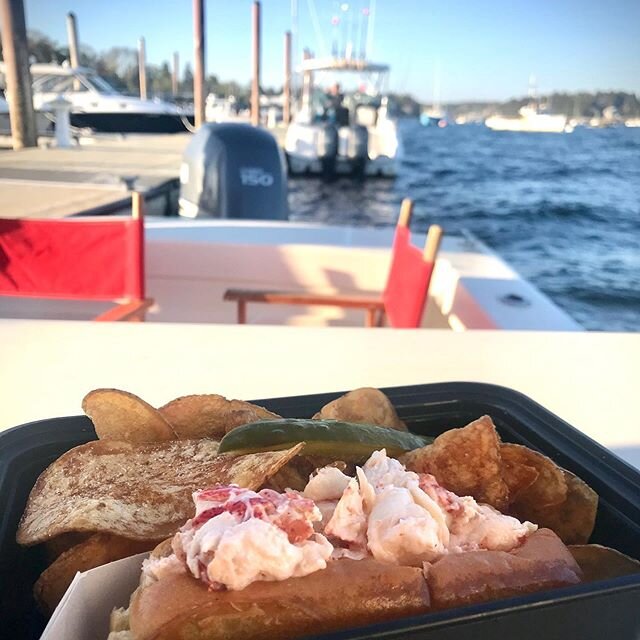 Dockside pickup is the new curbside. Eating a lobster roll @dolphinmarinaandrestaurant means summer is underway and we are so ready for it. #summerinmaine #mainecoast #lobsterfrommaine #lobsterrolls #docksidedelivery #themainefeed