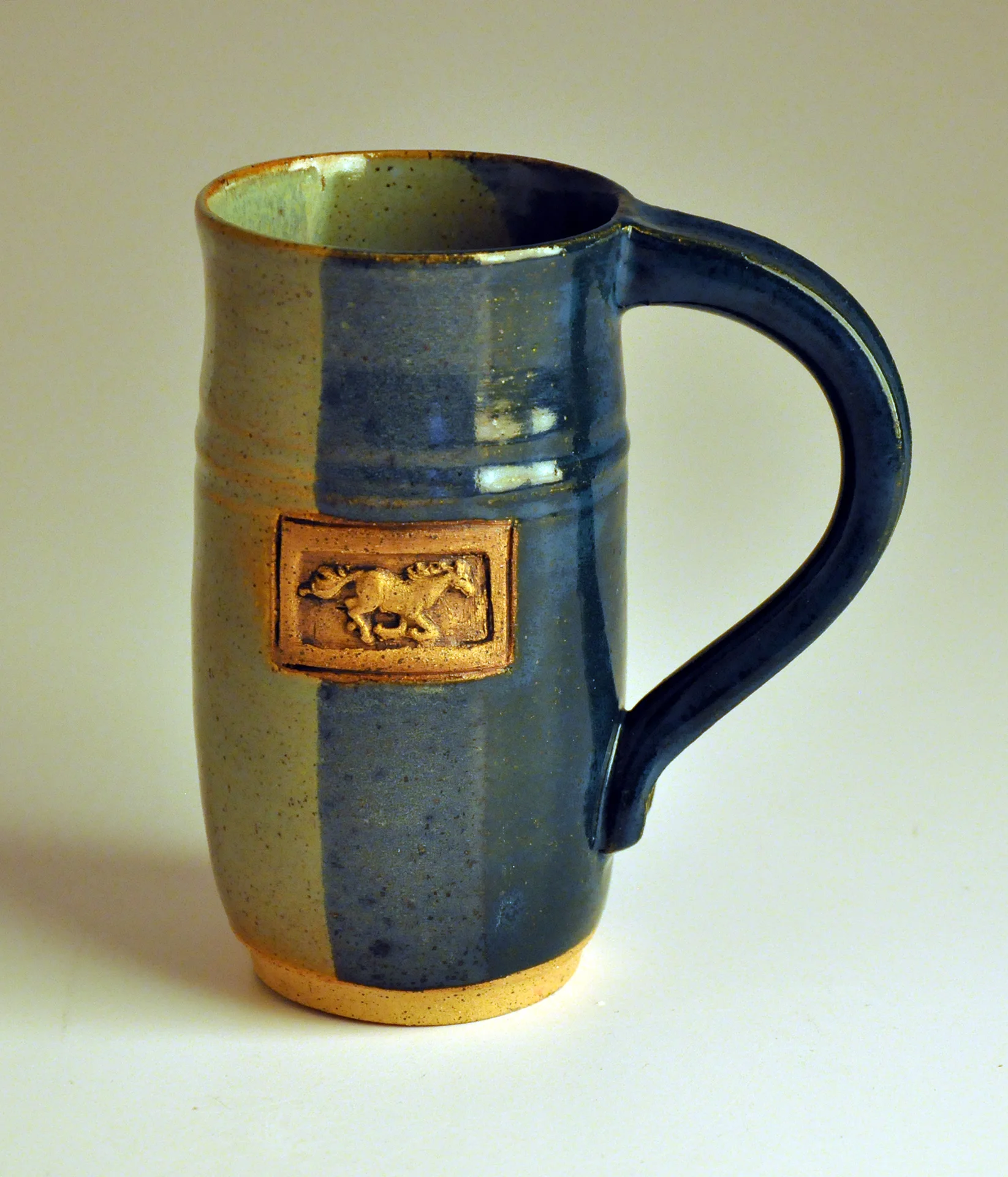 blue and green horse cup