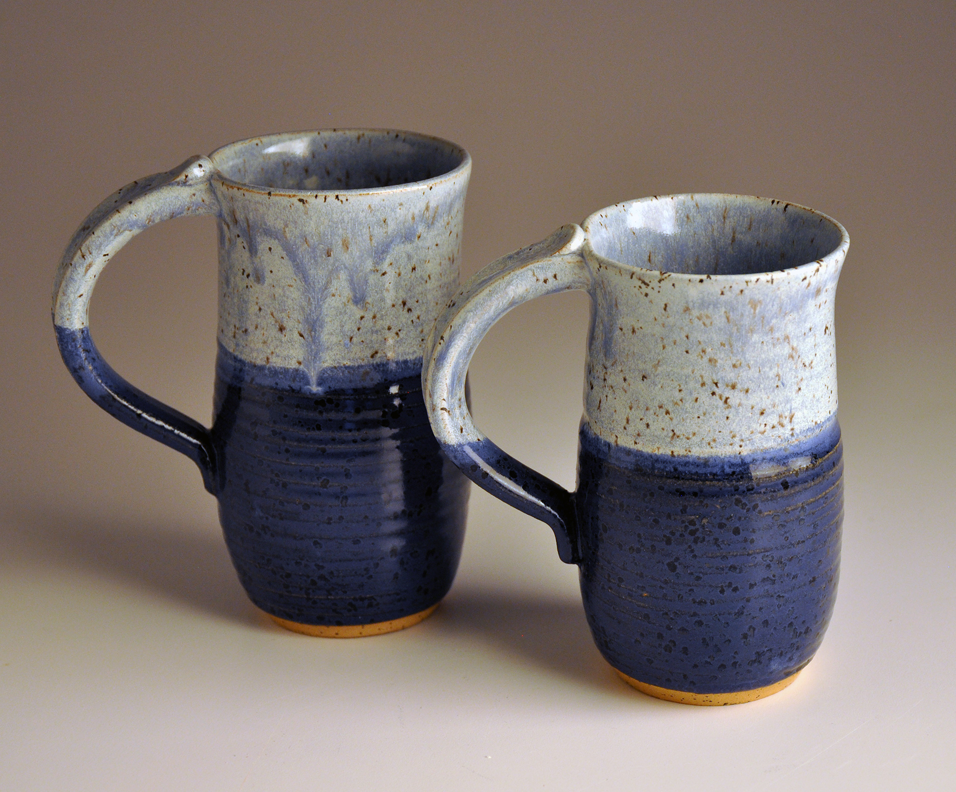 two light and dark blue cups