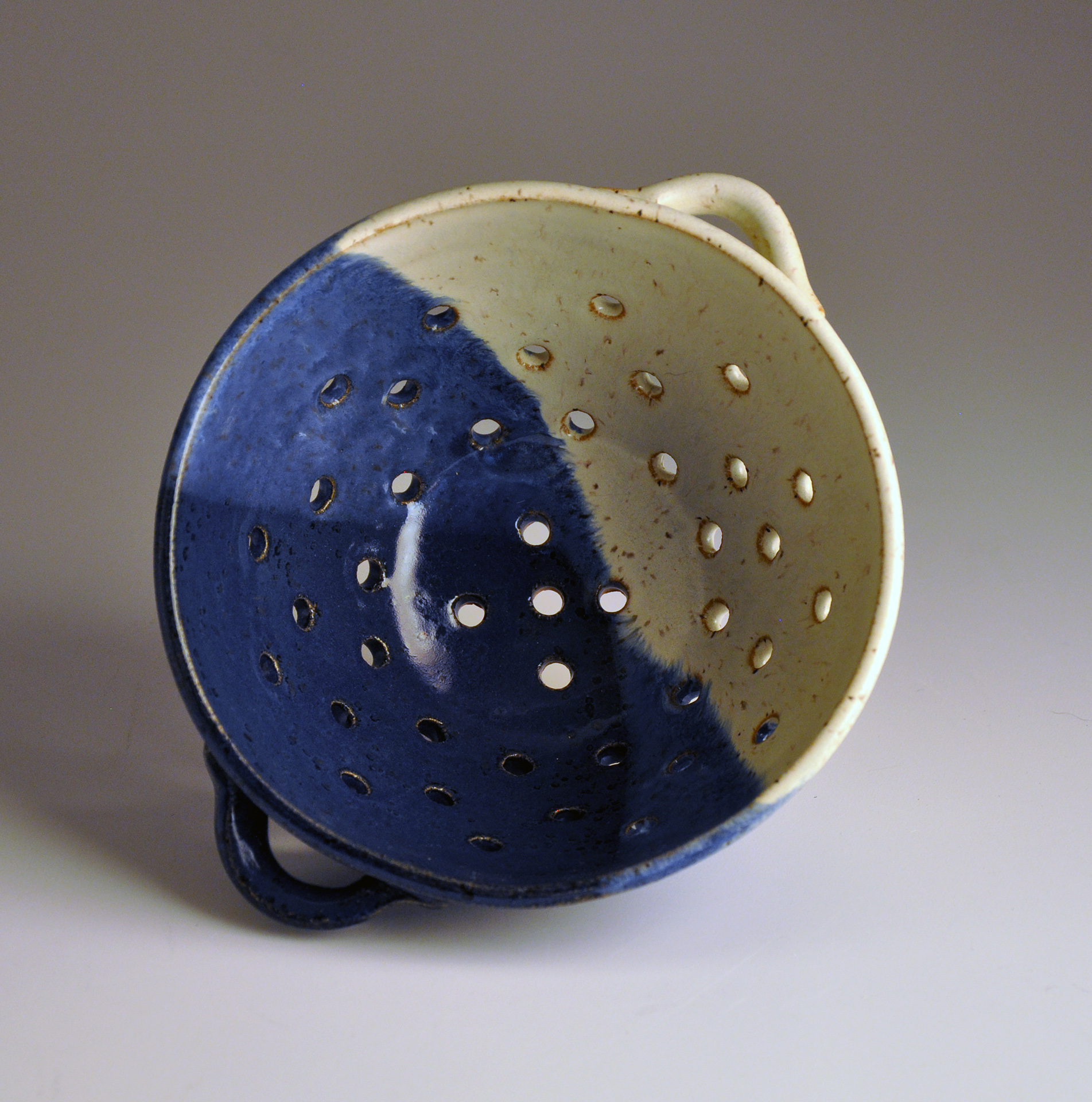 small blue and white collander