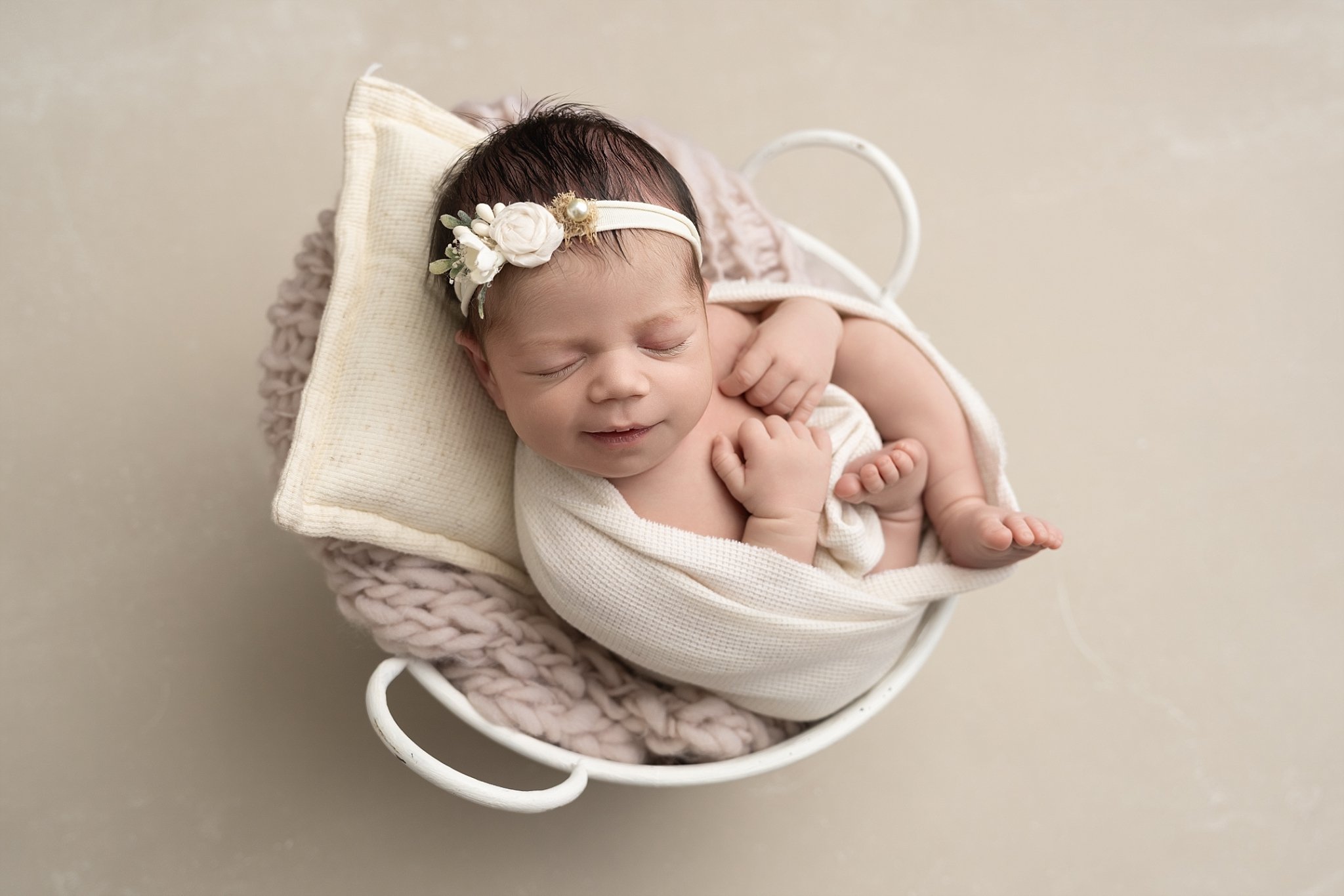 newborn-baby-smiling-in-basket-neutral.jpg.jpg