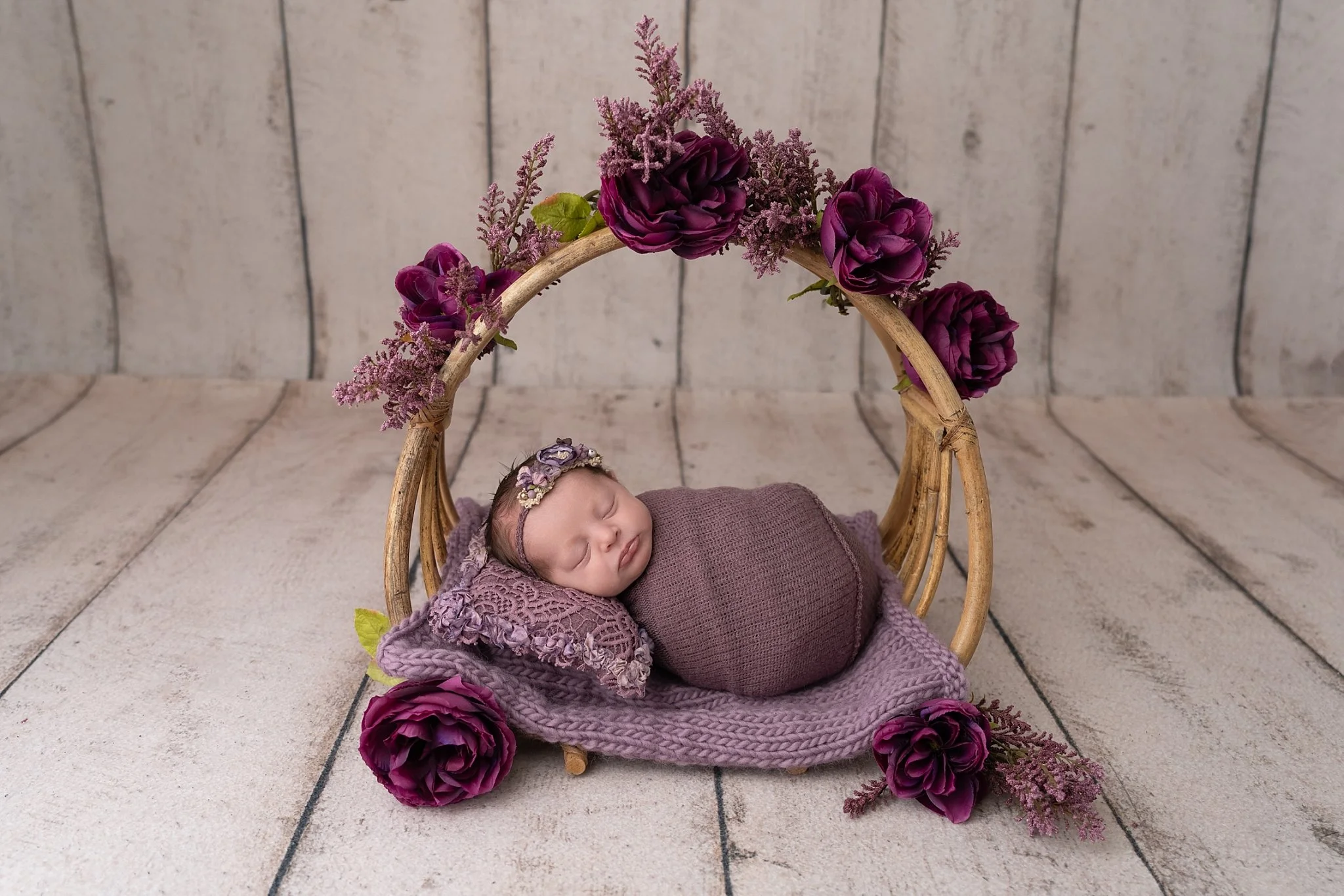 ✨ Welcoming the sweetest little dreamer ✨
This precious baby girl looked absolutely angelic in soft plum tones&mdash;snuggled up under gorgeous florals and resting so peacefully.

I will never get over how tiny, perfect, and calm these early days can