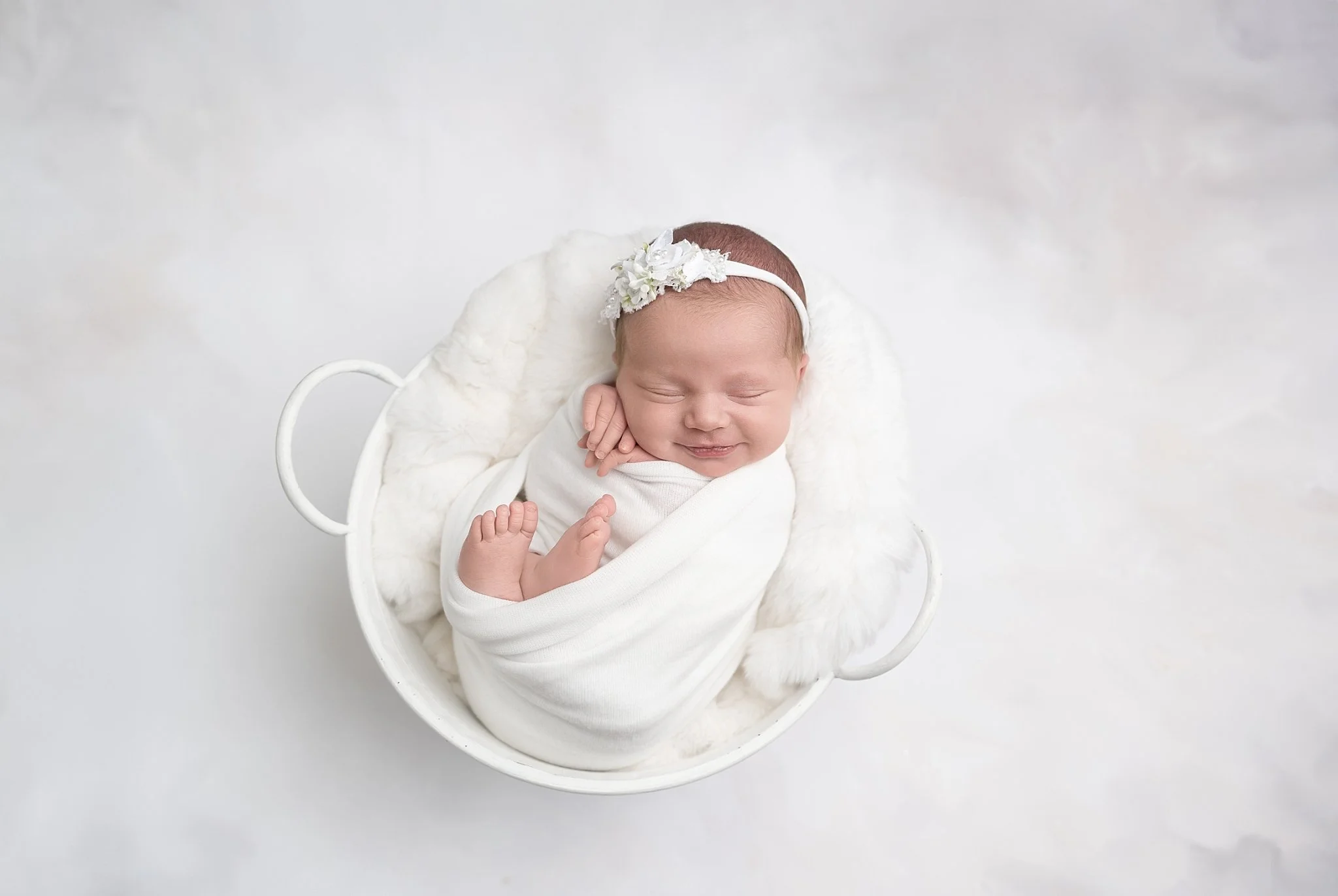The sweetest little smile wrapped in winter white ❄️🤍
She was an absolute dream for her session &mdash; cozy, calm, and full of tiny expressions.

✨ Newborn Promotion:
Book a Newborn Session and receive a FREE Maternity Mini OR Milestone Session!
ww