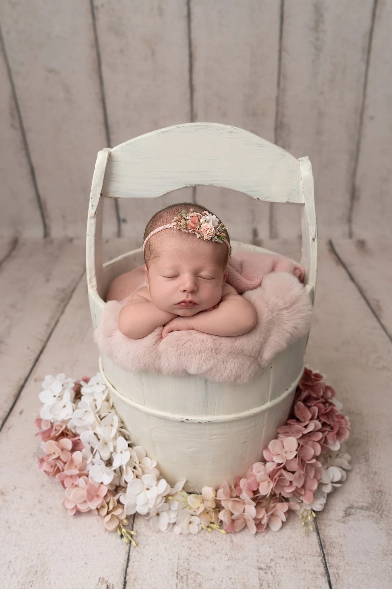 edwardsville-newborn-photographer-white-bucket-with-floral-newborn.jpg