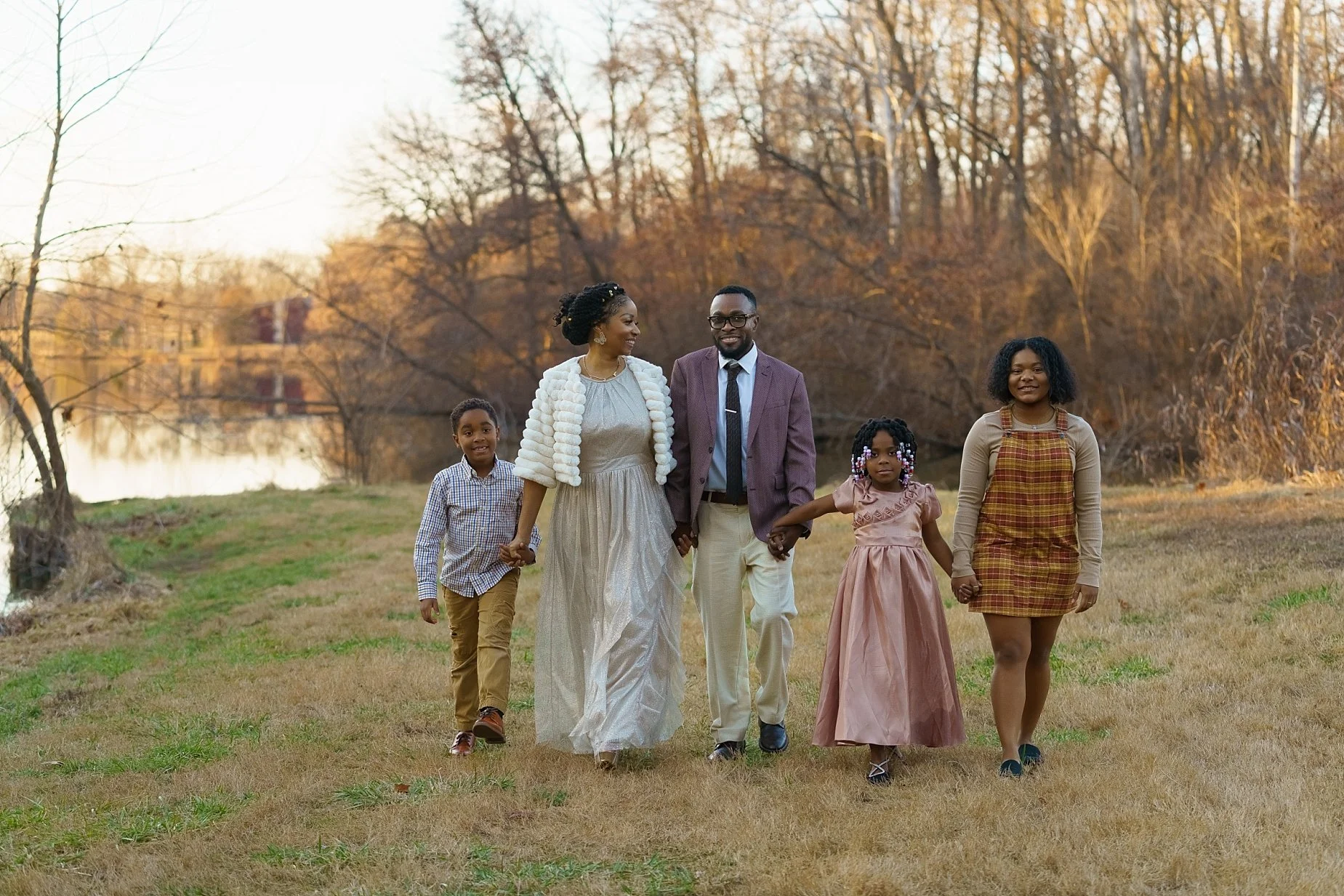 Family walking together at sunset during a wedding session in Glen Carbon Illinois