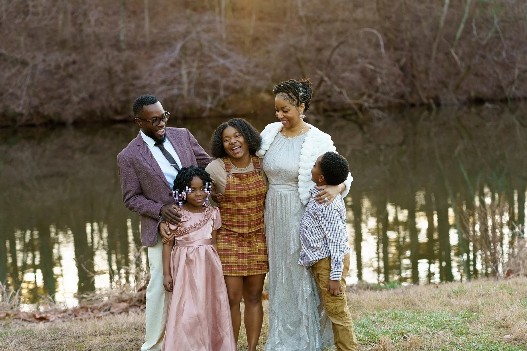 Wedding family session by the water in Glen Carbon IL with parents and children smiling together