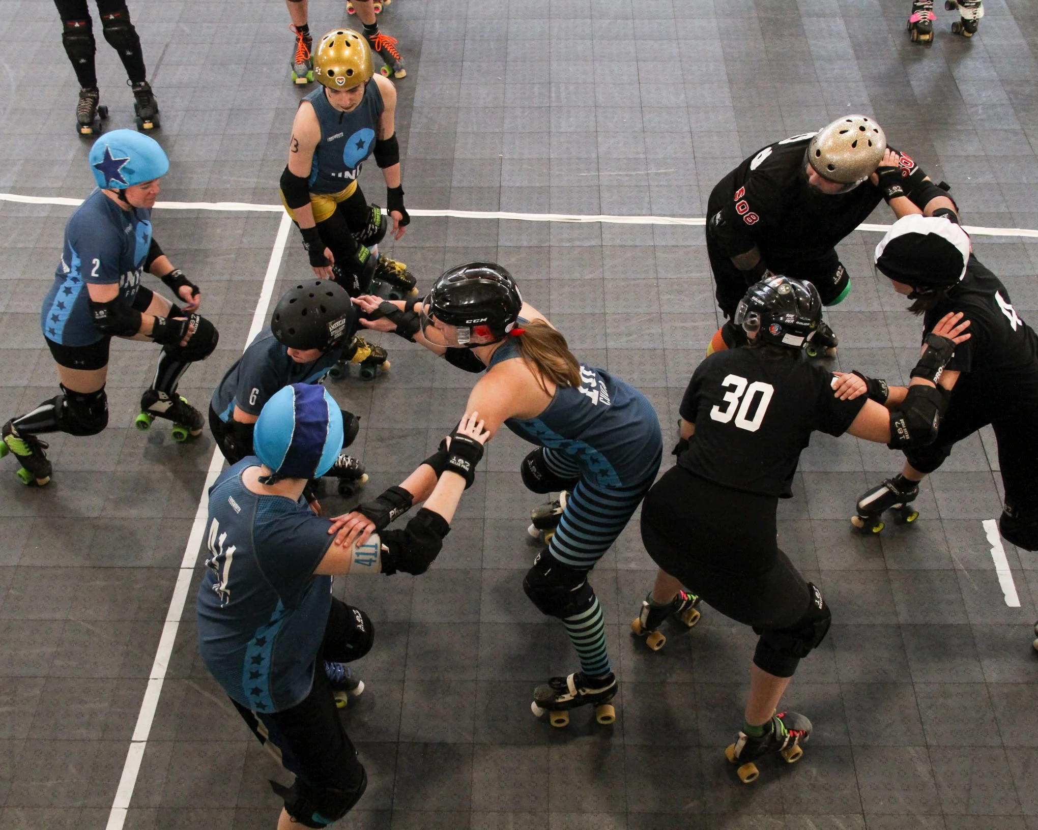Here, Baby and Rad make a tripod with Cryptic Kablam from Green Mountain Roller Derby at PVRD.