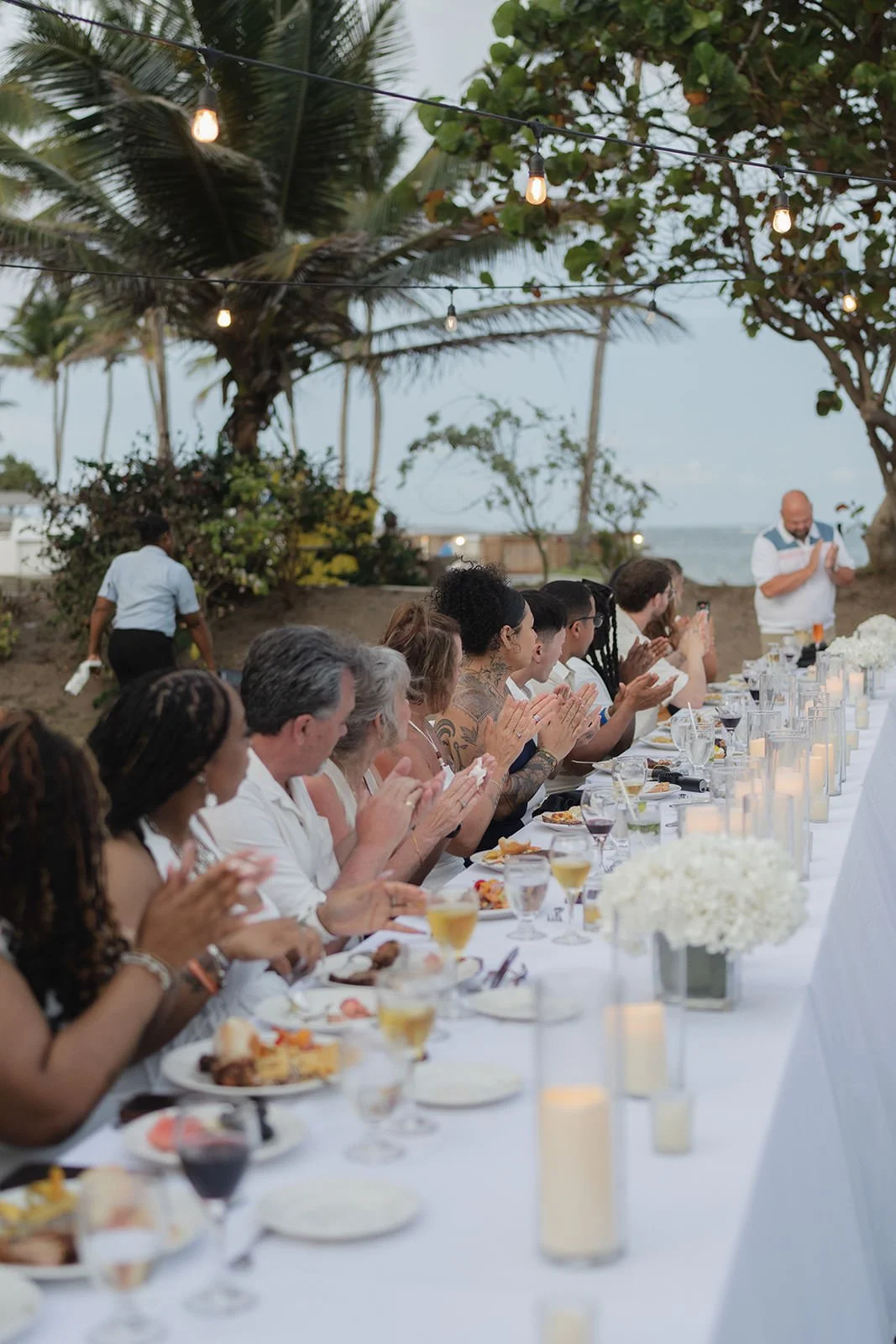 Wedding guests dining al fresco with ocean views in St. Lucia