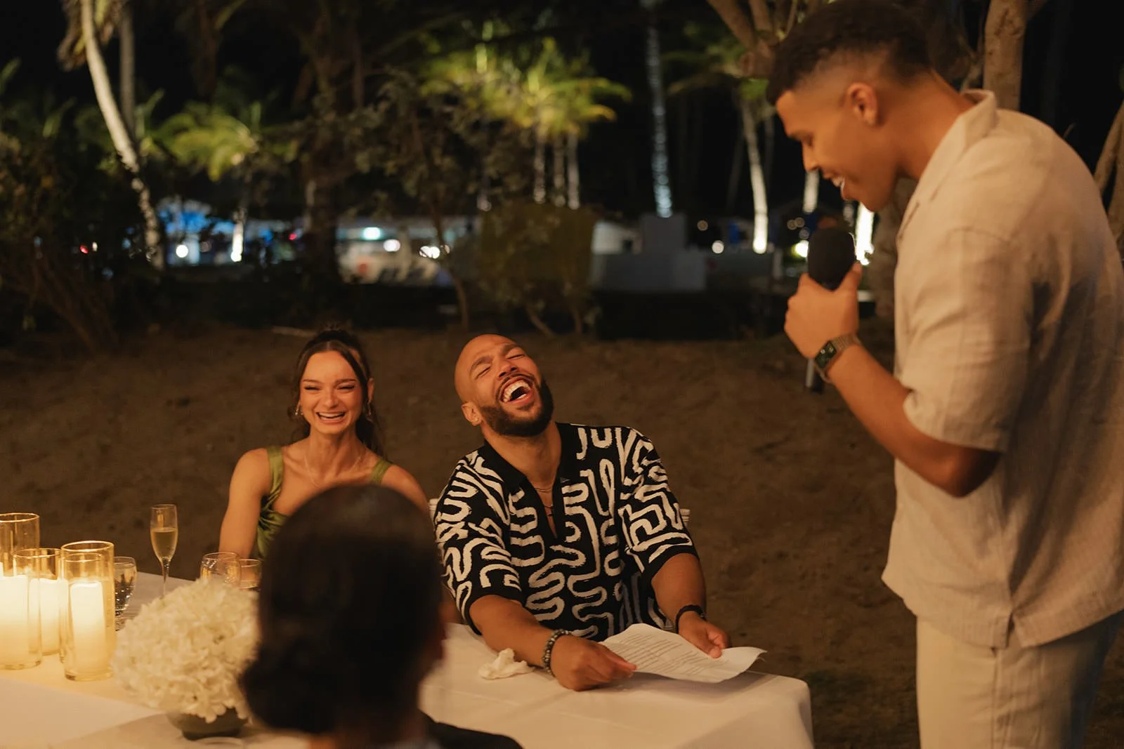 Bride and groom sharing a quiet moment at the welcome dinner table in St. Lucia
