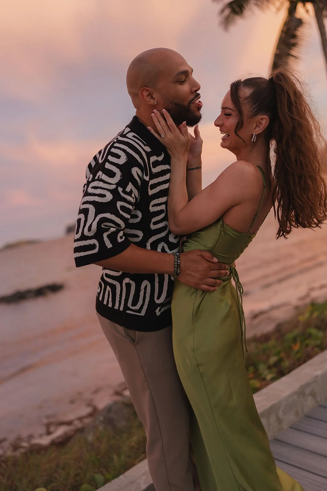 Bride and groom embracing outdoors at sunset during their St. Lucia wedding weekend