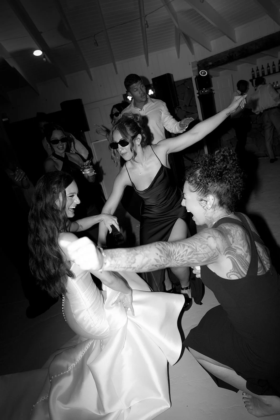 Black-and-white photo of the bride and groom's first dance, her gown twirling during the St. Lucia wedding reception