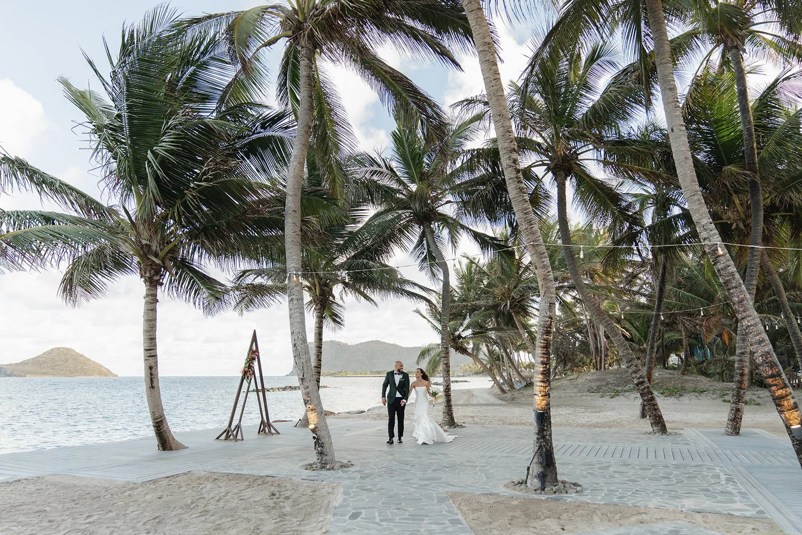 View of tall palm trees lining the beach path at the St. Lucia wedding venue