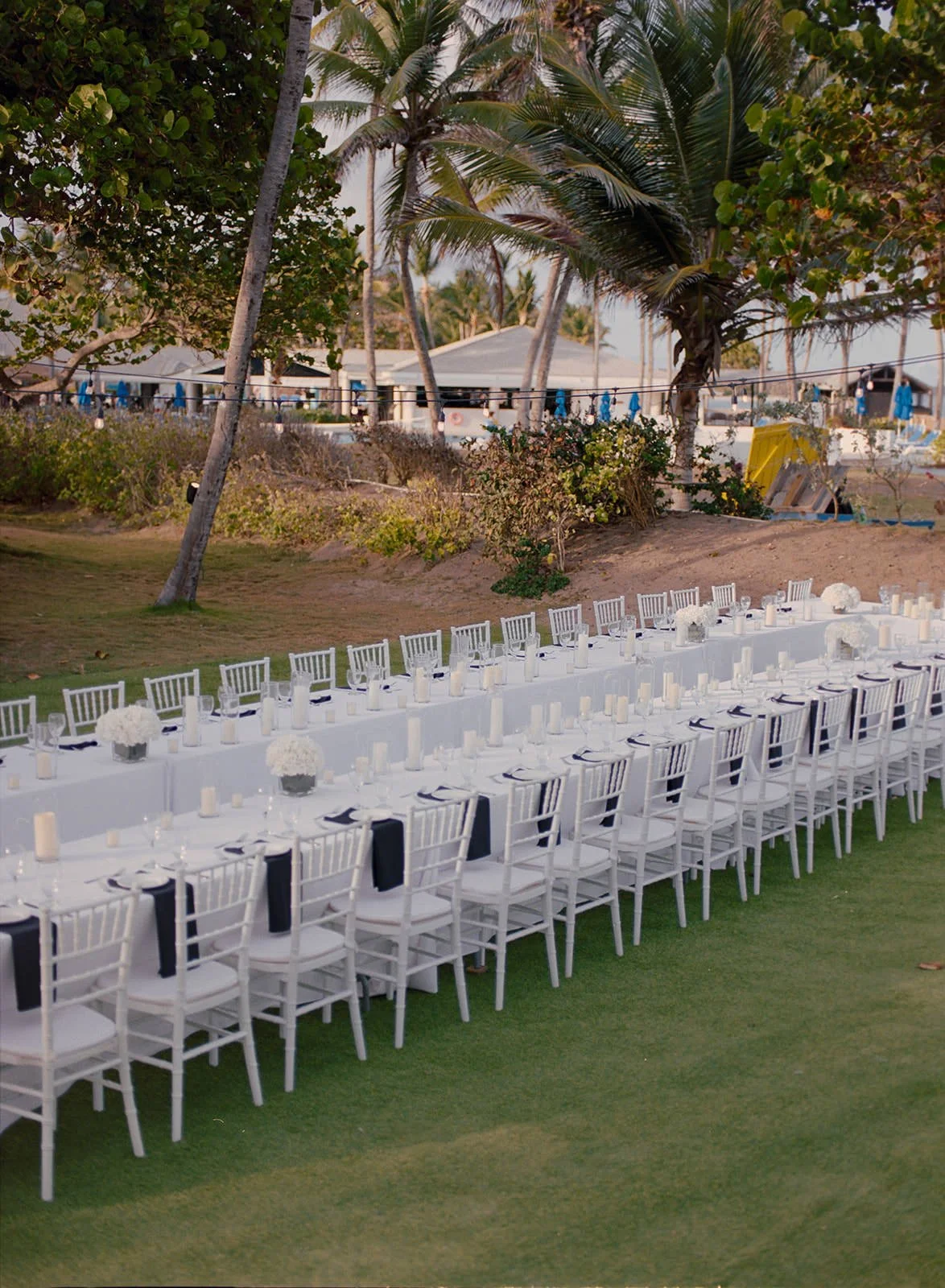 Rows of white chairs set up along the ceremony aisle at the St. Lucia wedding venue