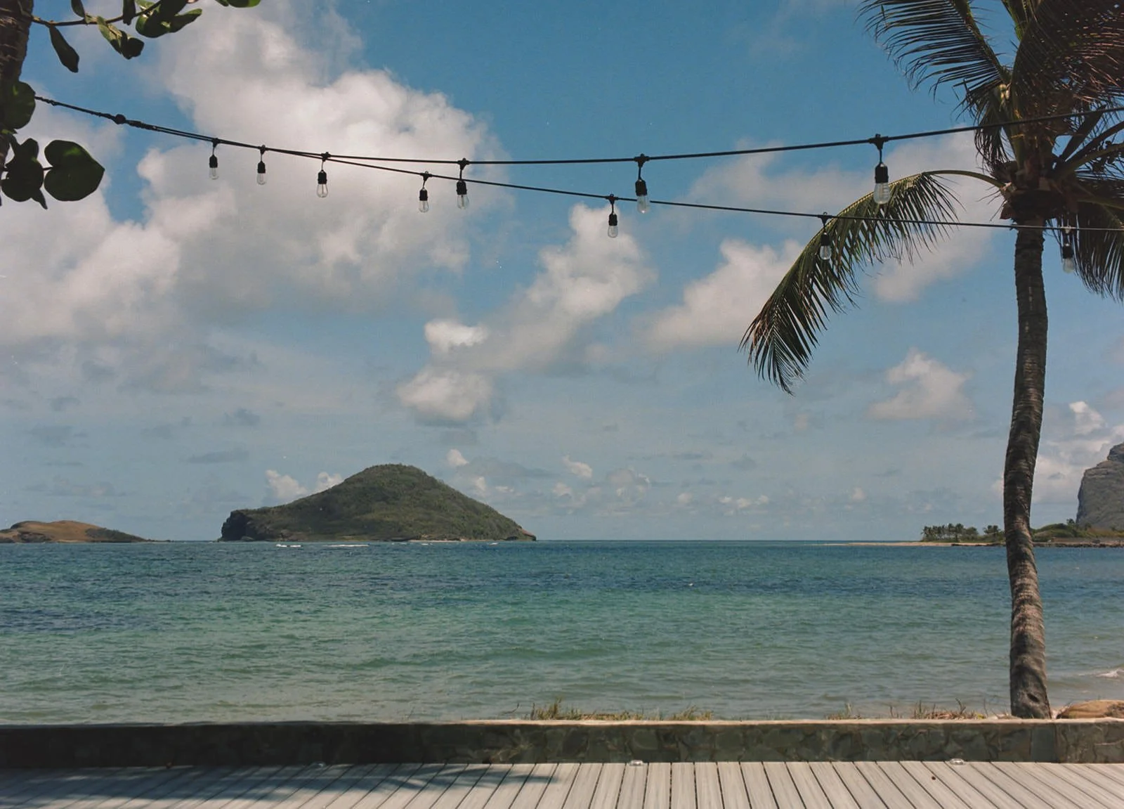 Scenic view of the ocean and distant islands off the St. Lucia coast under a partly cloudy sky