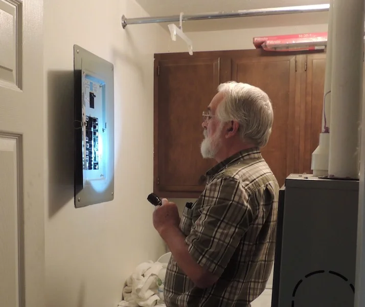 Inspecting electrical panel.jpg