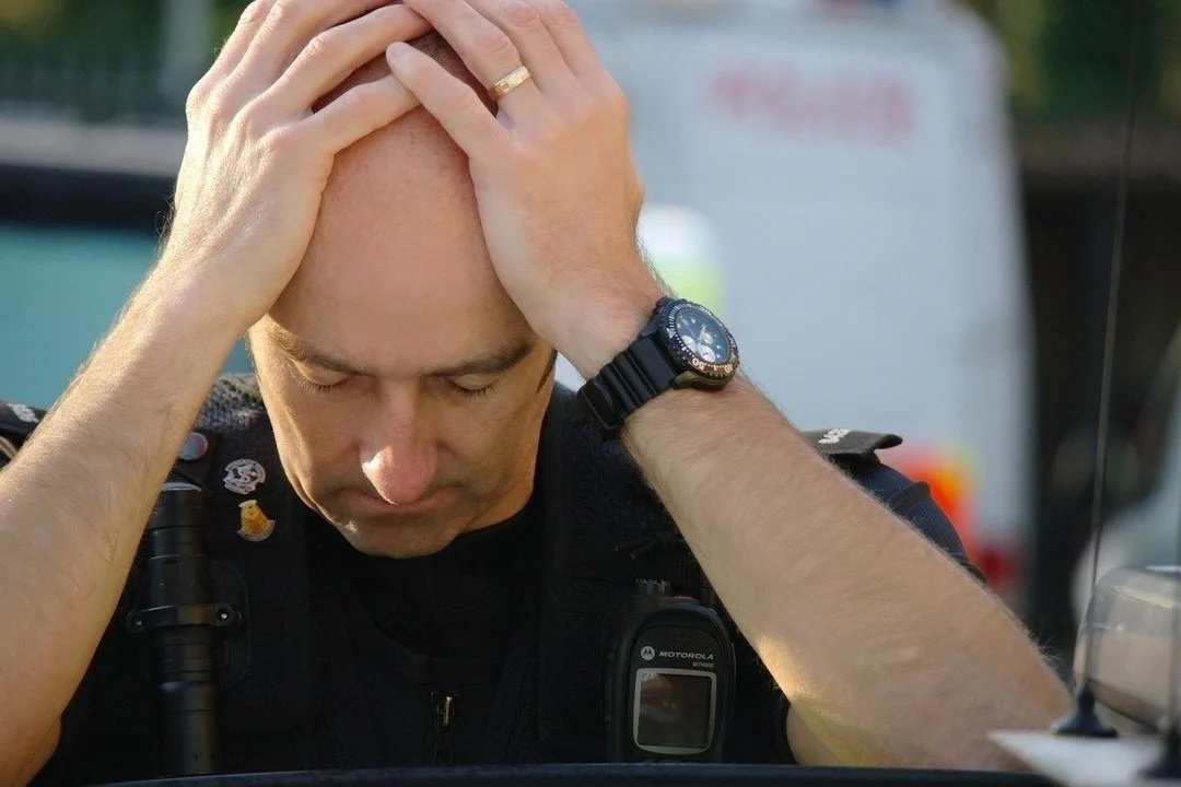 Fatigued%252Bpolice%252Bofficer.jpg