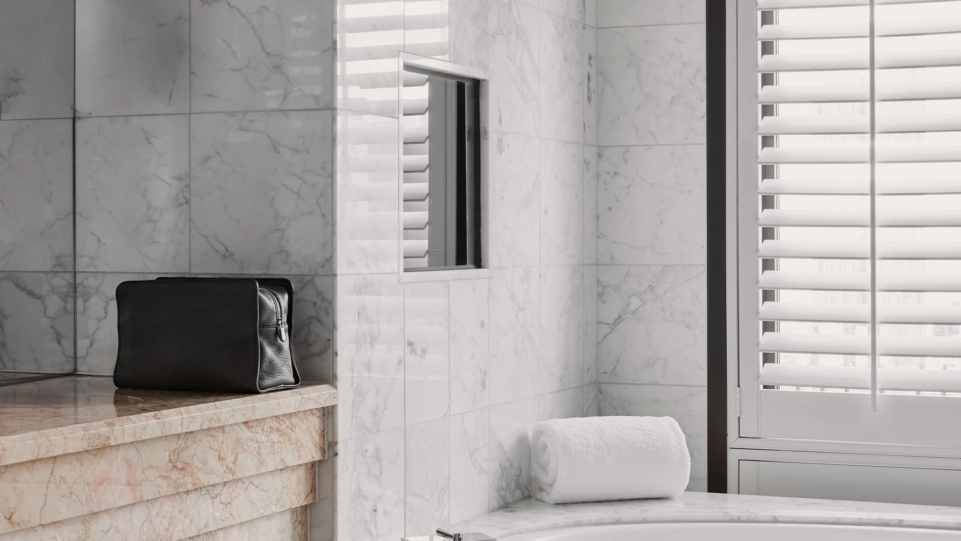 V&M SPA leather toiletry bag beside hotel window in soft morning light — luxury travel ritual with Australian made hair and body care